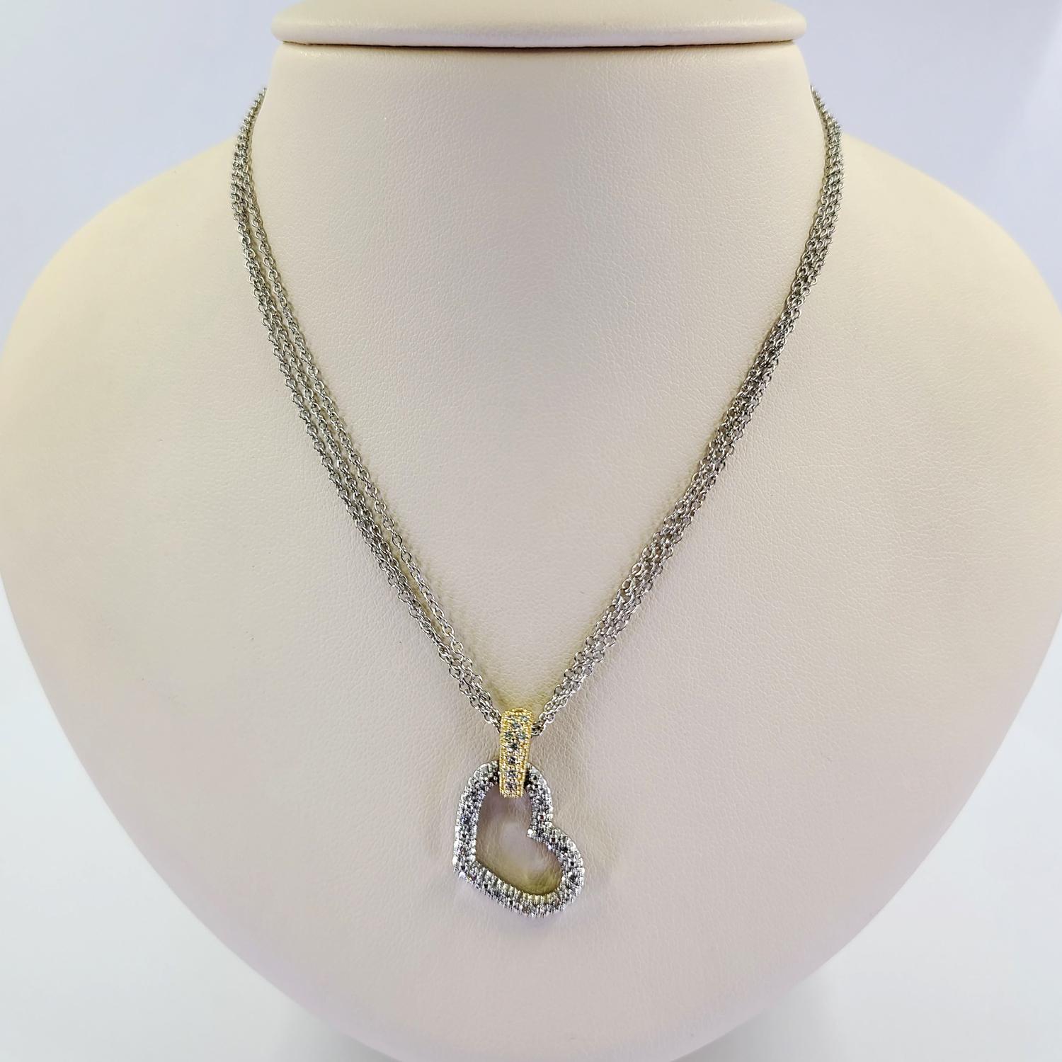 14 Karat White Gold Triple Chain Necklace with Pave Heart Pendant and Yellow Gold Bale Featuring 25 Round Diamonds of SI Clarity and H Color Totaling 0.25 Carats. 16 Inches Long with Lobster Clasp. Finished Weight Is 8 Grams.