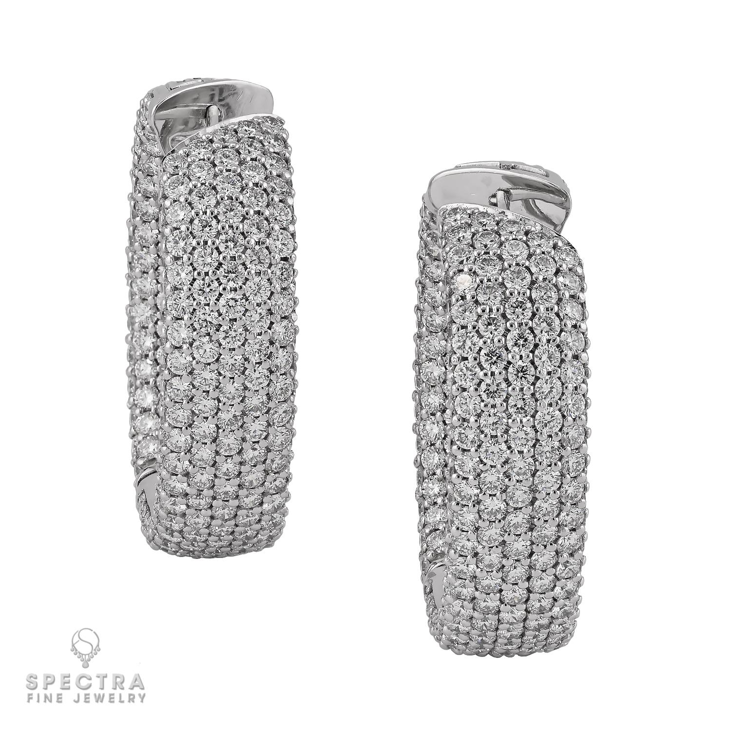 Timeless and effortlessly radiant, these elegant hoop earrings dazzle with approximately 10.56 carats of round brilliant-cut diamonds, meticulously pavé-set to create a continuous ribbon of sparkle. Crafted in 18k white gold and weighing 23.57
