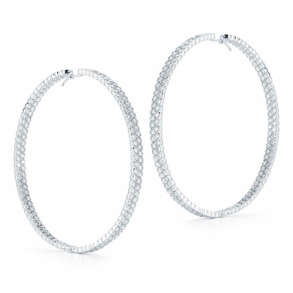 These hoop earrings feature round brilliant cut diamonds in 2 row settings. 
345 round brilliant-cut diamonds sparkle mightily from these gorgeous and glamorous white gold and diamond hoops, measuring 2.5 inches in length. The hoops dance and dazzle