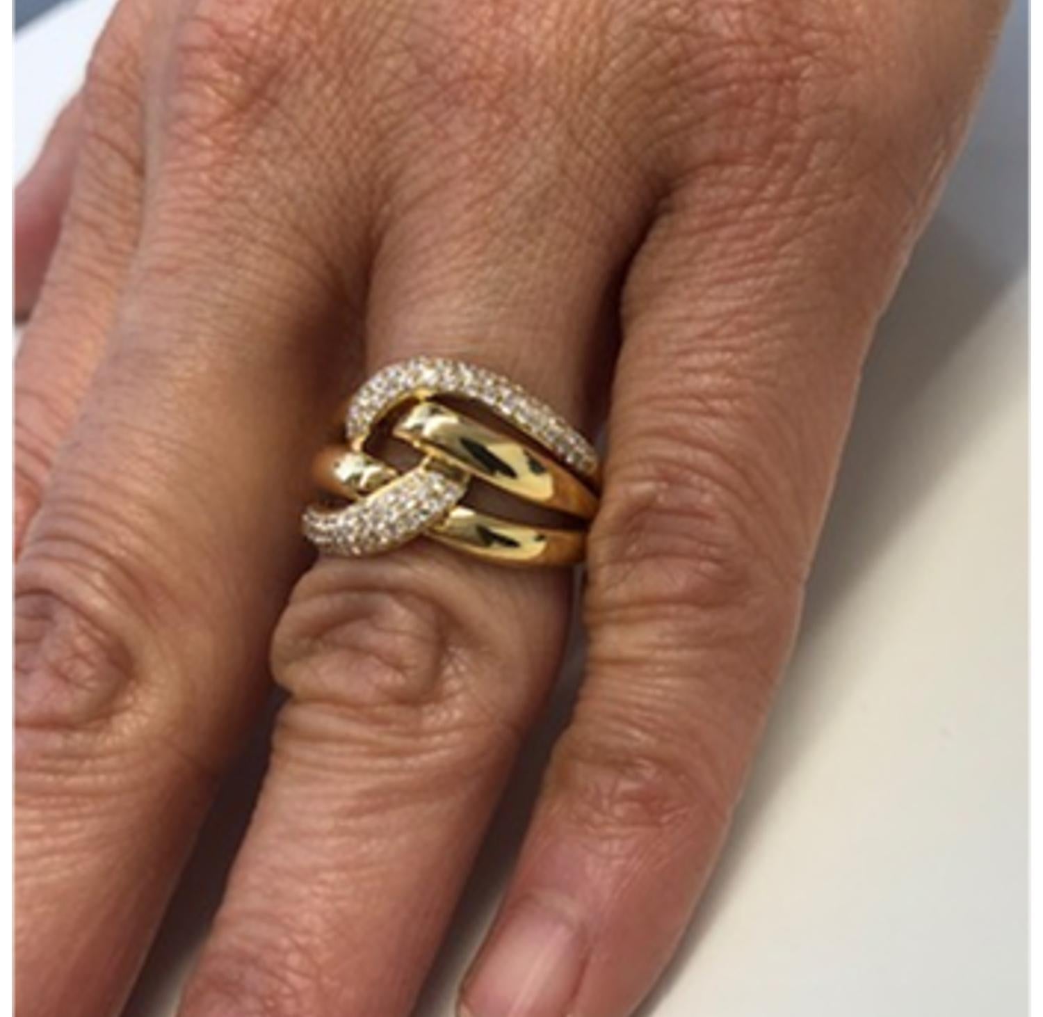 Sparkly round brilliant cut diamonds weighing a total of .63 carats are pave set in this ring. It is a modern take on a classic woven knot design. So pretty and wearable! Make this one your signature piece. Made of 18k yellow gold.

Ring Size: