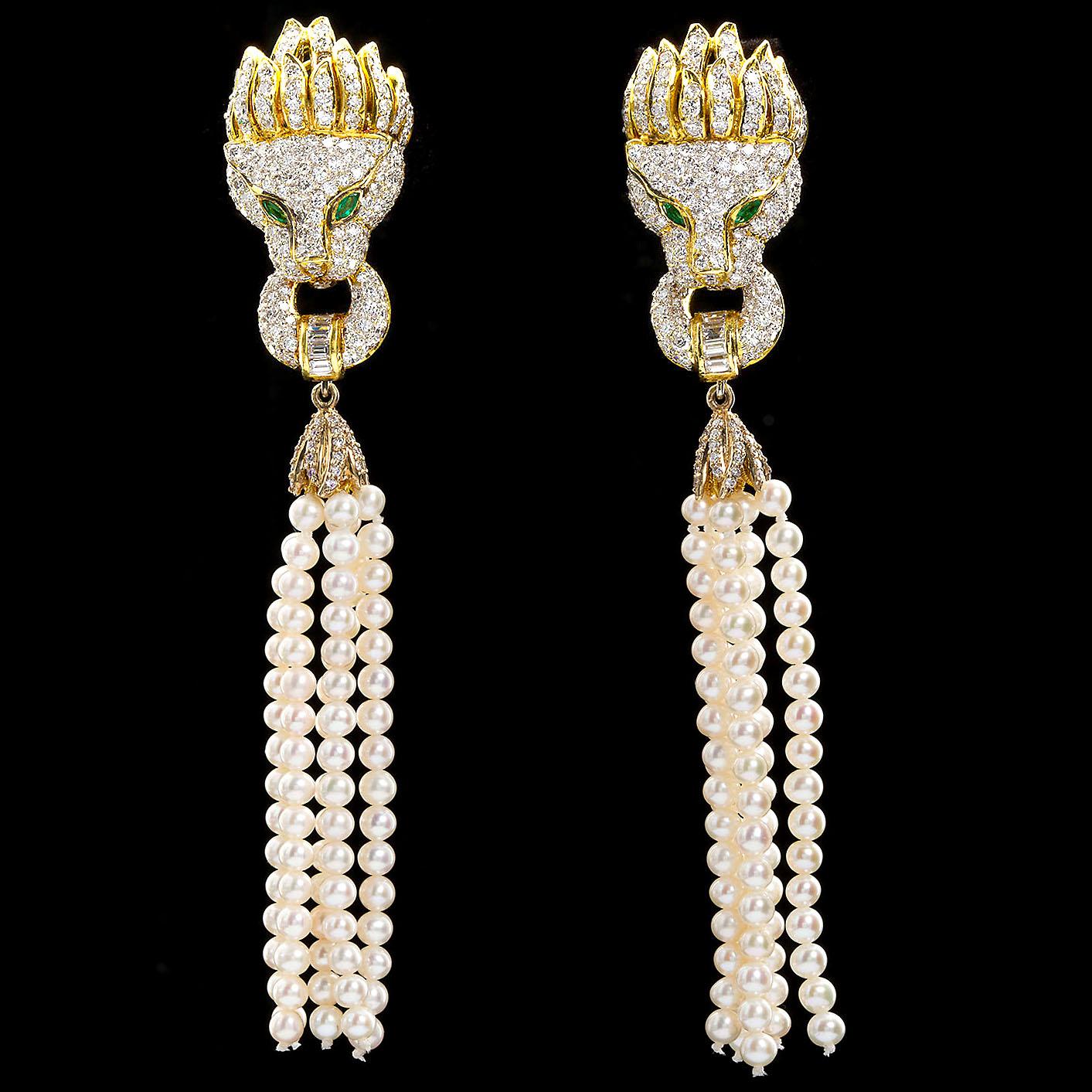 A fantastic pair of diamond pavé in 18 karat gold Lion head with diamond pavé mane and emerald eyes accent earrings. A pair of removable cultured pearl tassels take these critters to the next level. 

Diamond weight: approx. 8.00 ctw
Emerald weight: