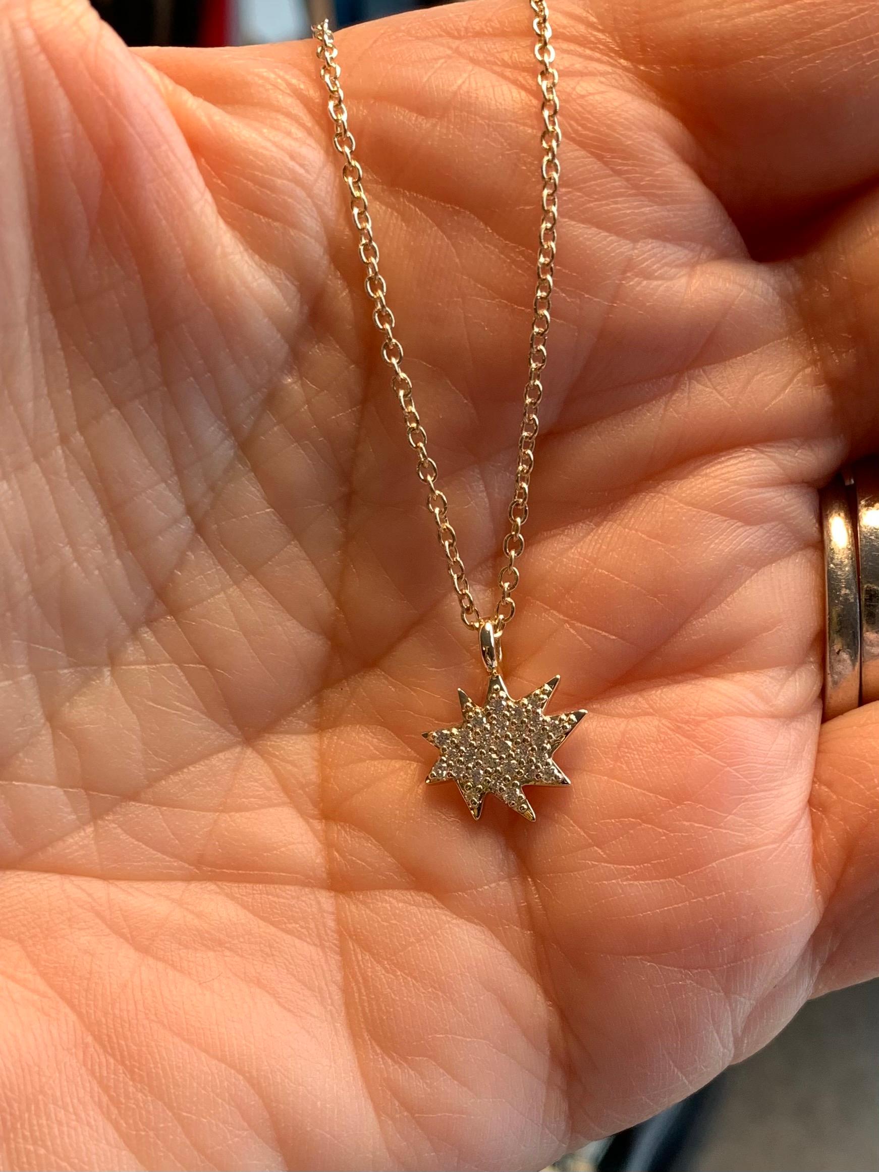 Elegant and adorable! Our Mini Stella Necklace is the perfect piece to layer or wear alone. Our iconic 14k gold organic star in a new delicate size hangs on a 14k gold chain and sparkles with pavé diamonds. Great alone or worn a few at a time!
 
14k
