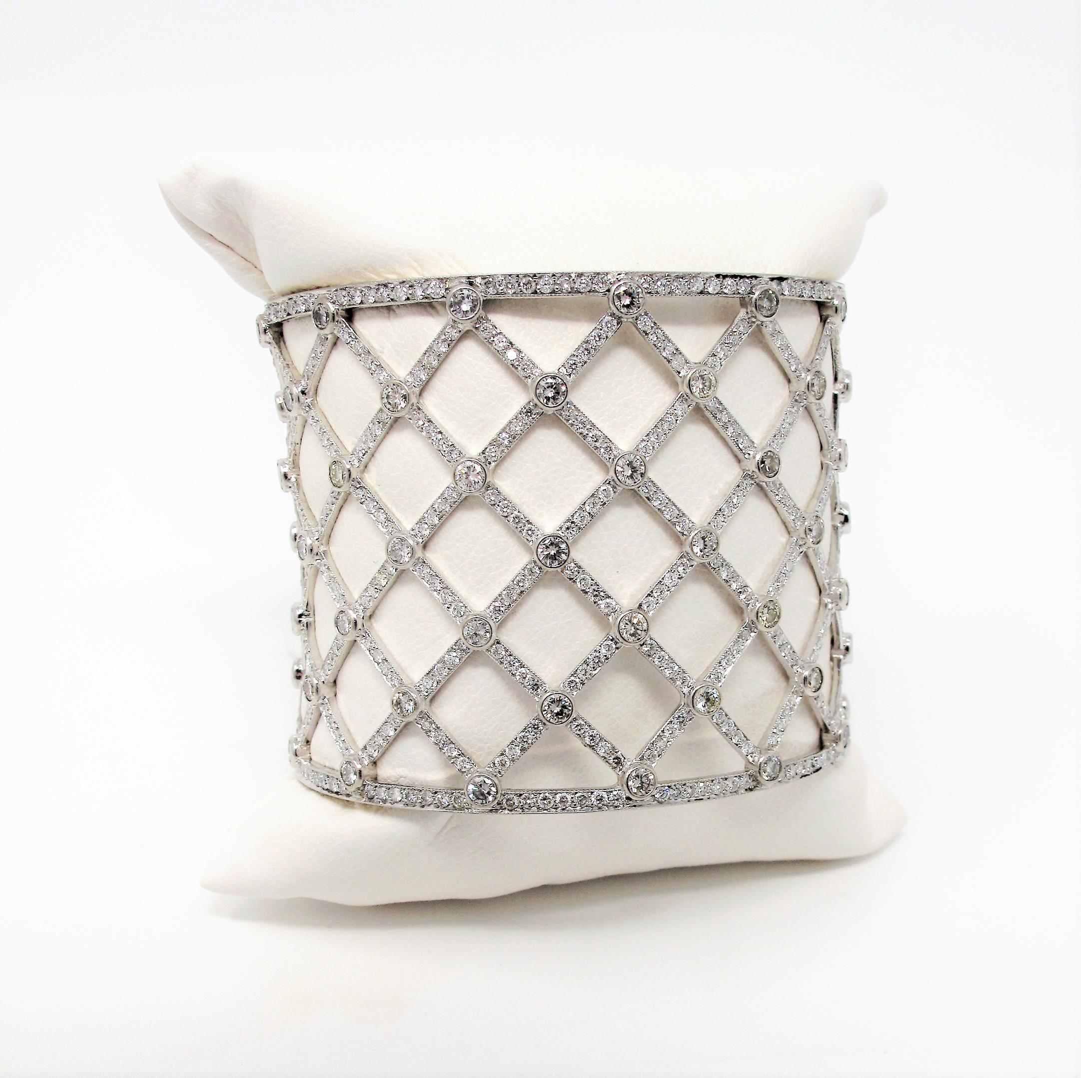 Wrap your wrist in modern elegance with this stunning diamond lattice cuff bracelet. This piece glitters from all directions with hundreds of natural diamonds and is guaranteed to upgrade any look you pair it with. If you are a lover of sparkly