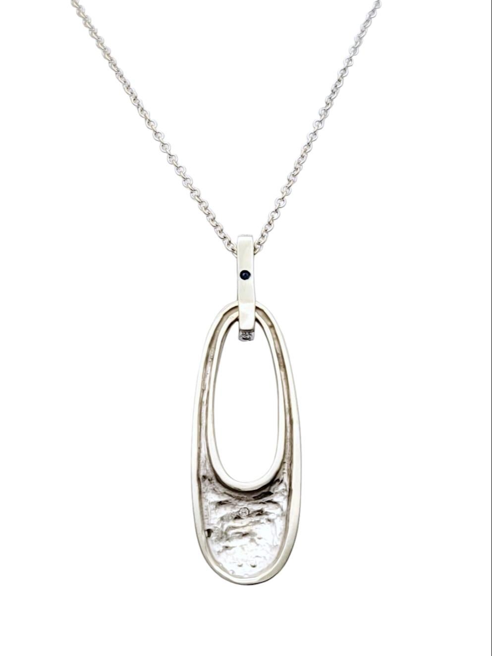 Round Cut Pavé Diamond Oval Shaped Drop Pendant with Cable Chain in 14 Karat White Gold For Sale