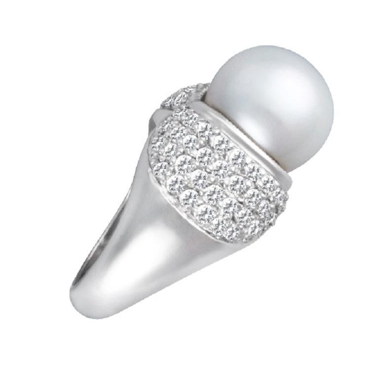Dainty pave diamond ring with a 12mm pearl ring in 14k white gold setting with approximately 1 carat in G-H color, VS-SI clarity diamonds.  This Diamond ring is currently size 0 and some items can be sized up or down, please ask! It weighs 9.2