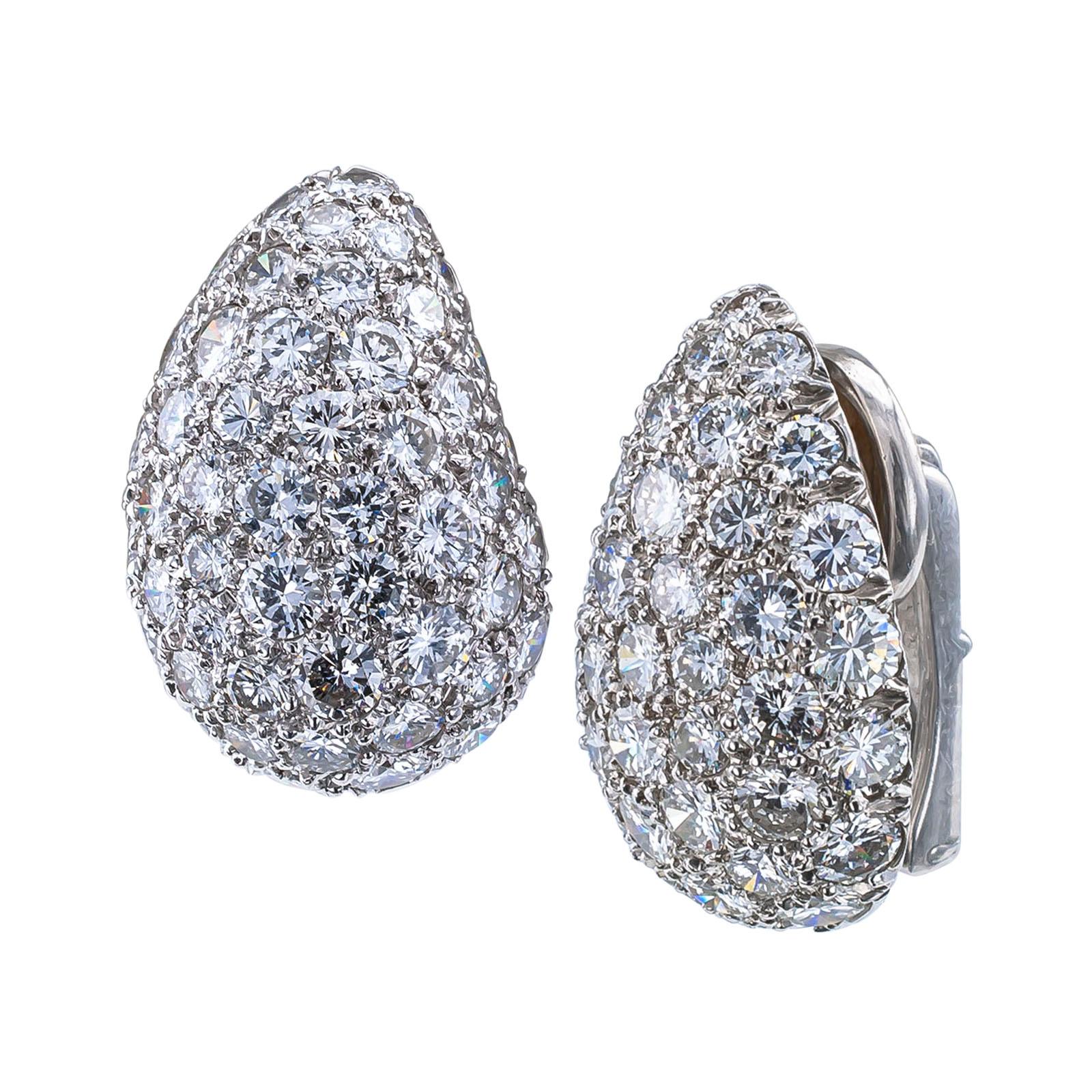 Diamond platinum and white gold ear clips circa 1950.

DETAILS:
Half-domed diamond pave platinum and white gold ear clips.
DIAMONDS: one hundred round brilliant-cut diamonds totaling approximately 8.00 carats, approximately G – H color and VS