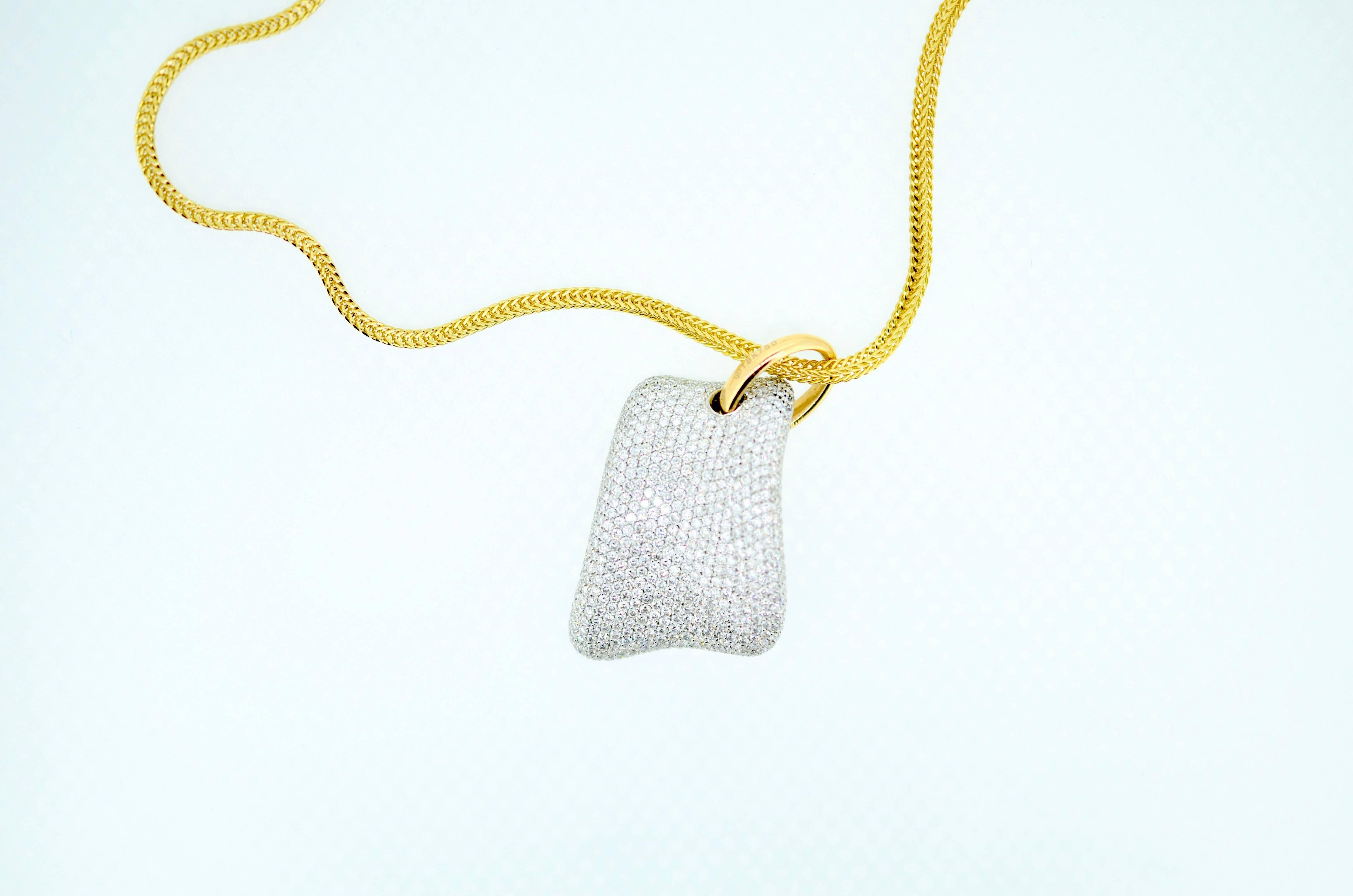 Diamond Puff Pillow Pendant. Diamonds pave set in asymmetrical 18kt. white gold. Suspends on 18kt gold ring and 18kt gold square 2.75mm snake chain. Pillow 1.38 inches by .75 inches by 4.5mm deep. Approximately 3.0ct total weight. VS2 clarity, G-H