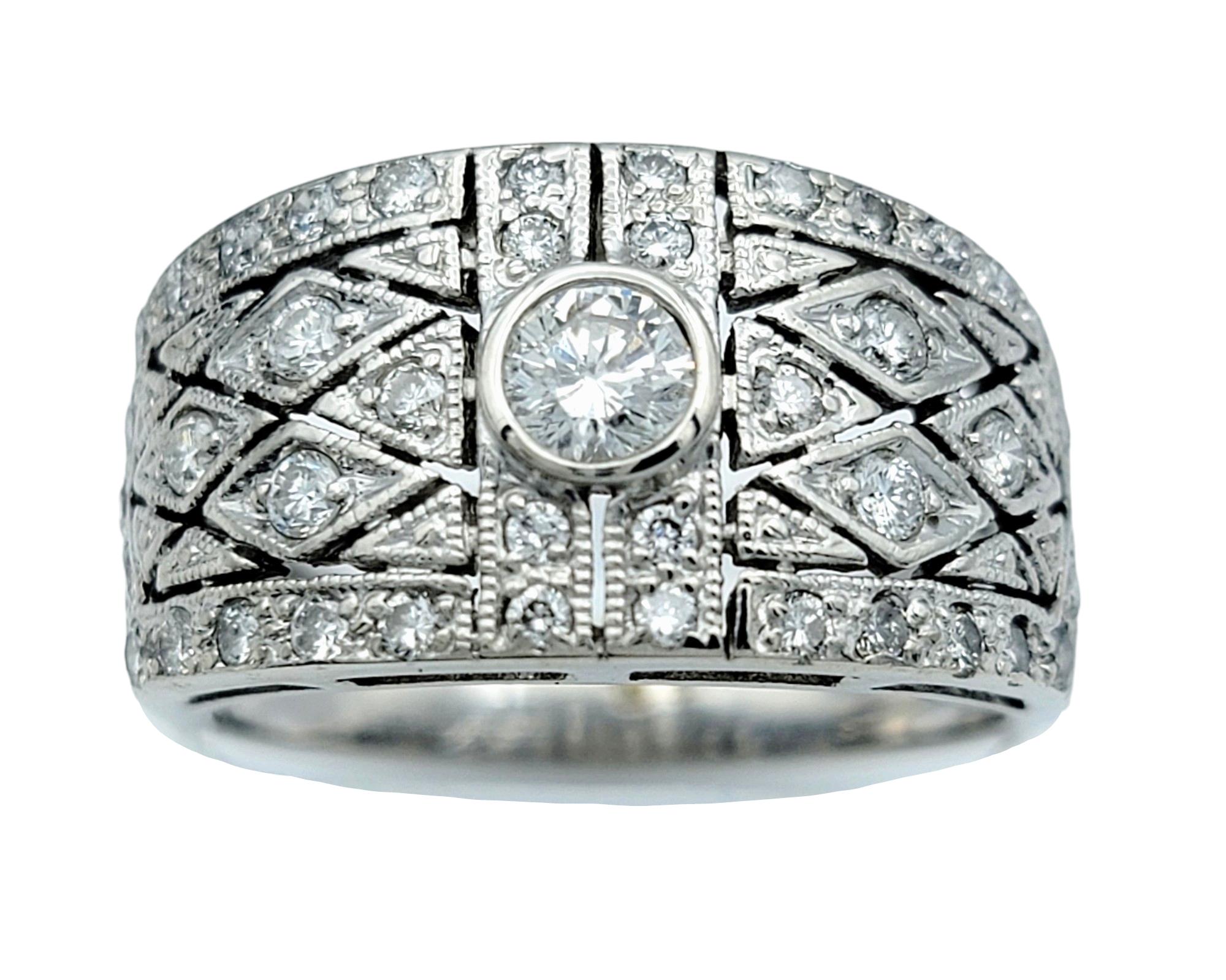 Ring Size: 7.75

This elegant pavé diamond band ring, crafted with meticulous attention to detail in 14 karat white gold. The band features a unique quilted cut-out design that adds a modern twist to the classic pave setting. Each tiny diamond is