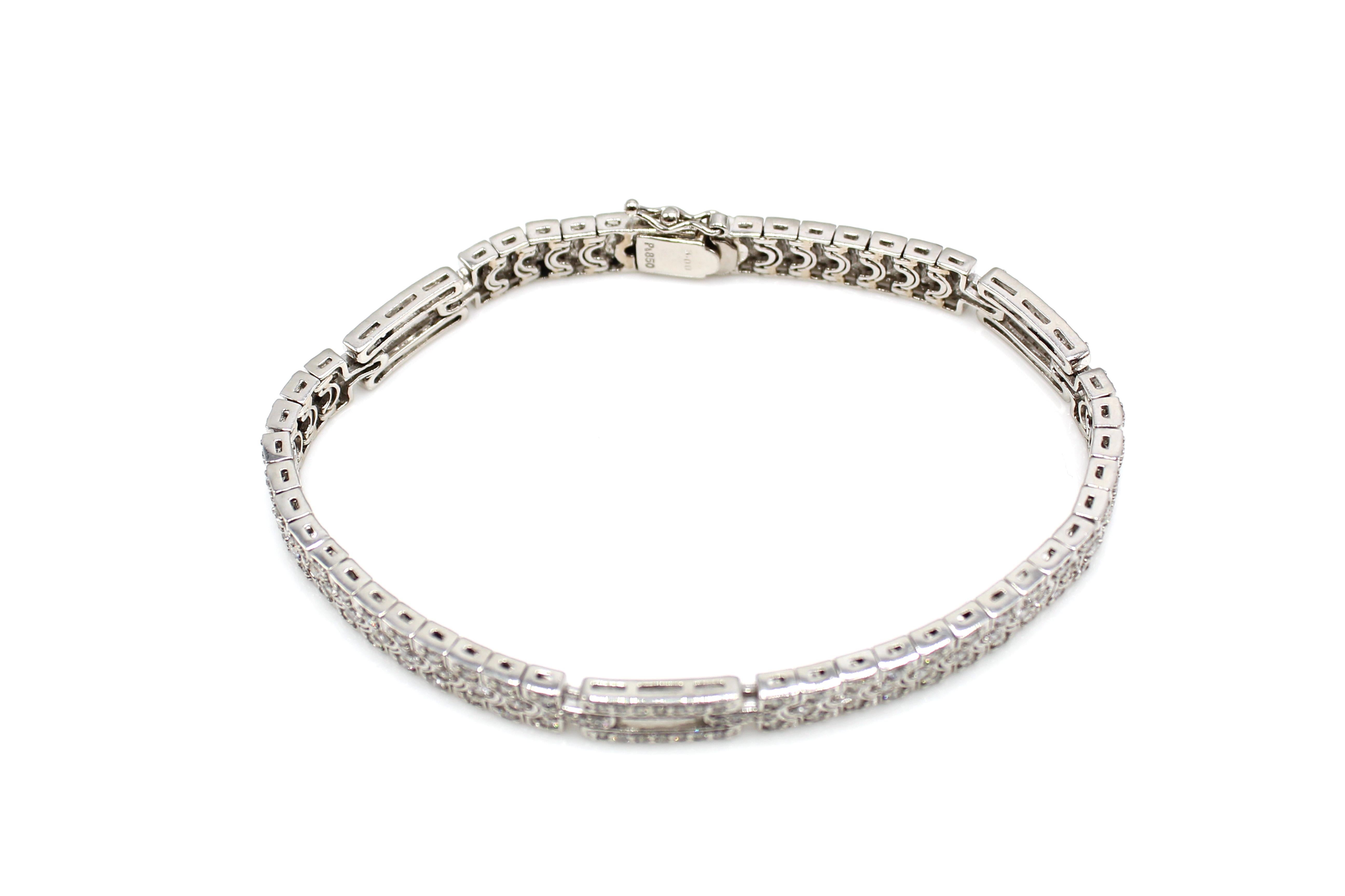 This absolutely beautiful platinum bracelet is set with 192 round cut diamonds. The diamonds are perfectly matched in color, clarity and cut to show off a gorgeous stream of sparkling white, which elegantly and extremely comfortably falls around the