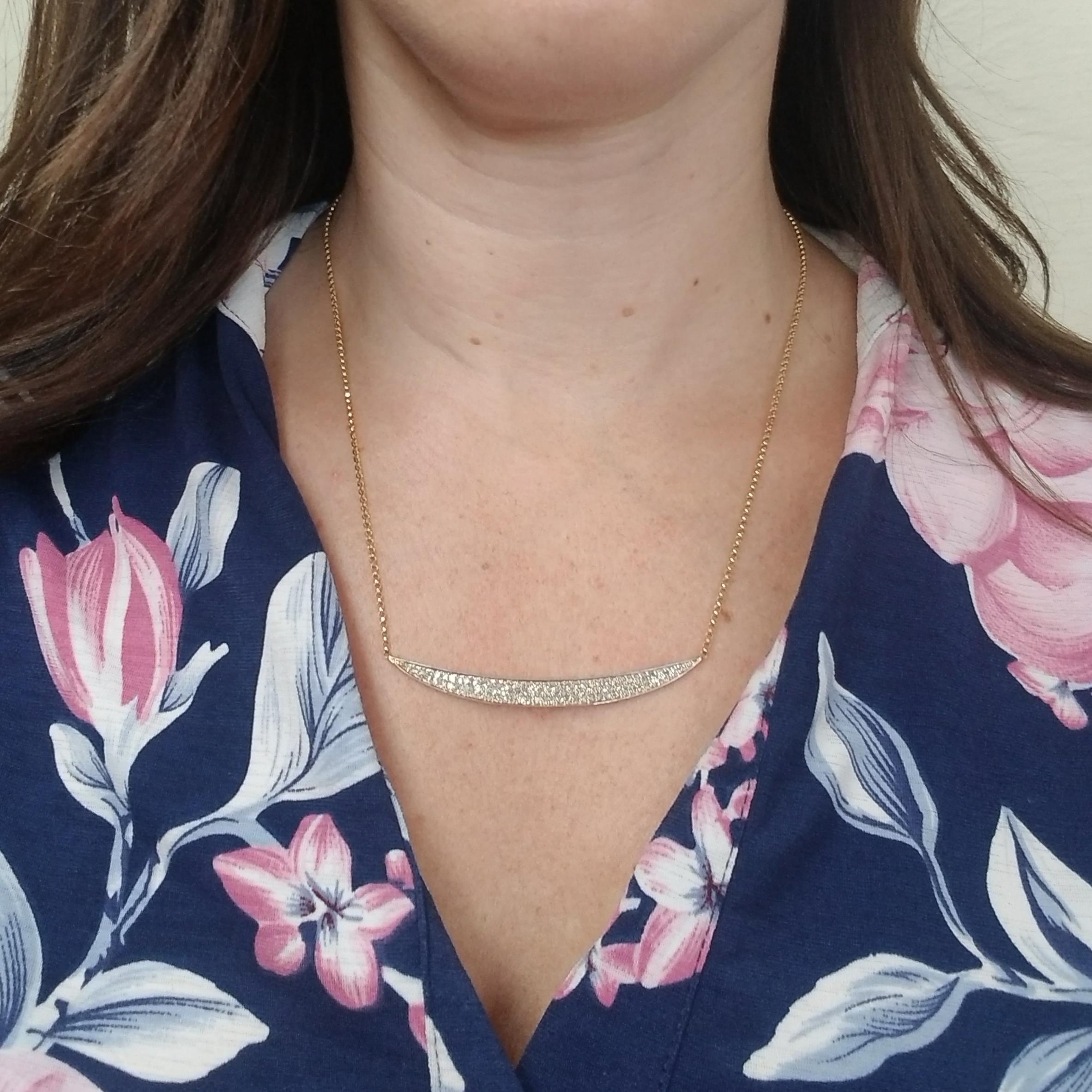 14 Karat Yellow Gold Curved Necklace Featuring 86 Round Brilliant Cut Diamonds Totaling Approximately 1 Carat Total Weight. The Diamonds Are Pave Set & Graded As SI Clarity & I Color. Chain Length is 18 Inches With Lobster Clasp.