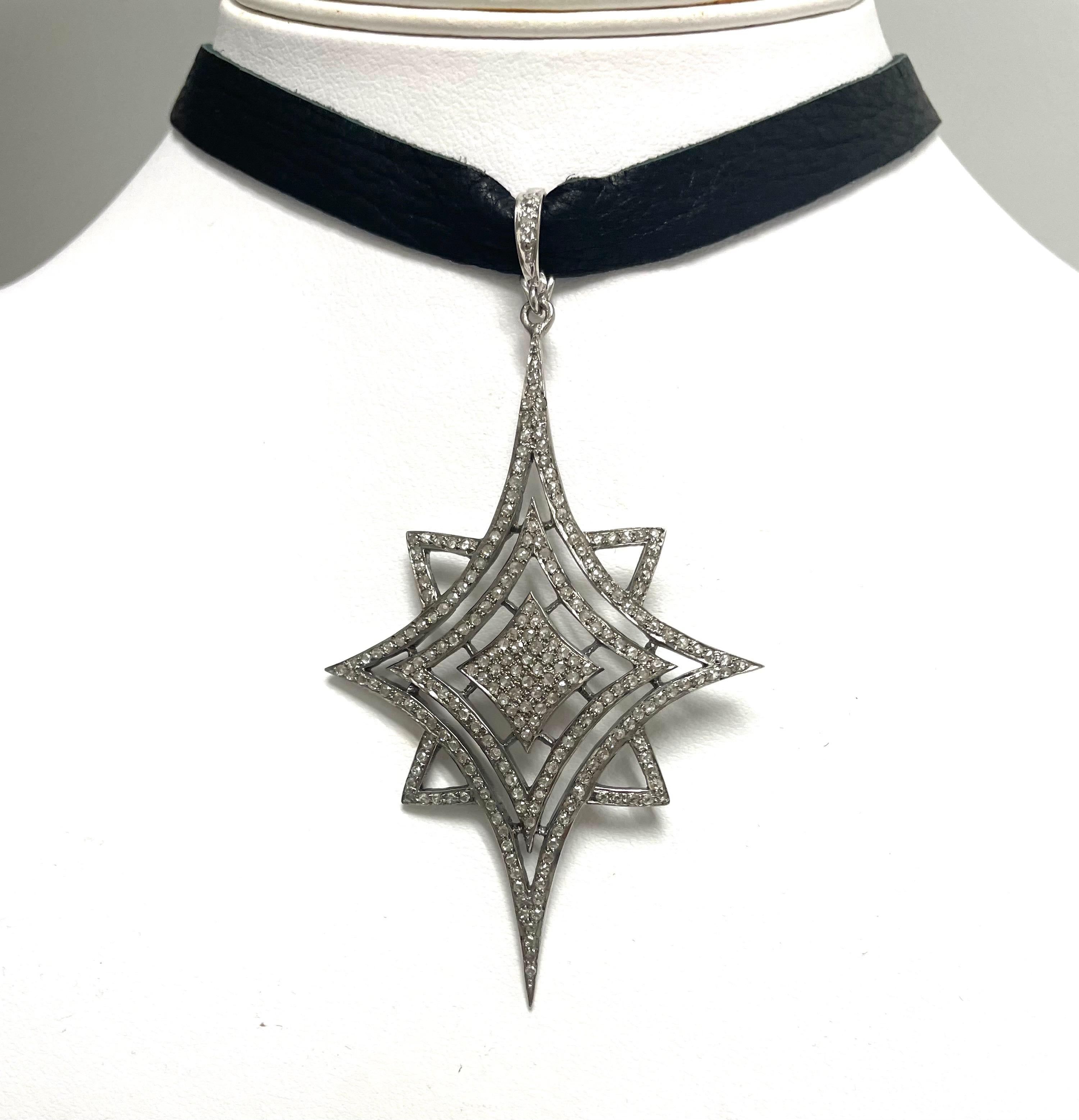 Description
Stunning pave diamond starburst pendant suspended from a beautiful black soft deerskin choker, reversible to suede, length (13.25”) extends with a chain to 14.75”. Item # N3800

Materials and Weight
Pave diamonds 3cts.
Faceted balls 3mm