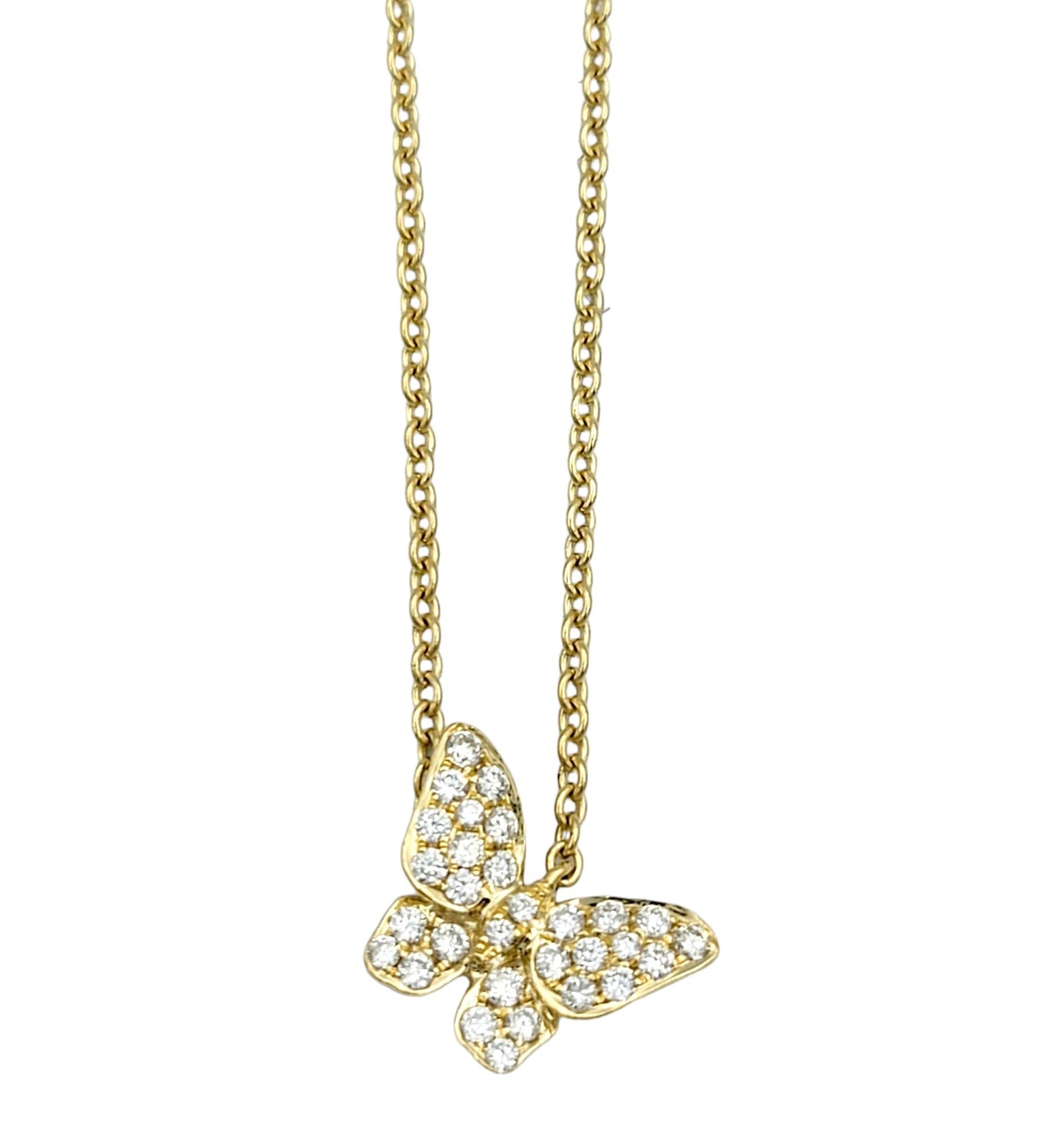 This stunning pavé diamond butterfly pendant necklace, set in 18 karat yellow gold, is an exquisite piece that features a delicate butterfly design, adorned with sparkling pavé diamonds that shimmer with every movement.

The slightly offset pendant