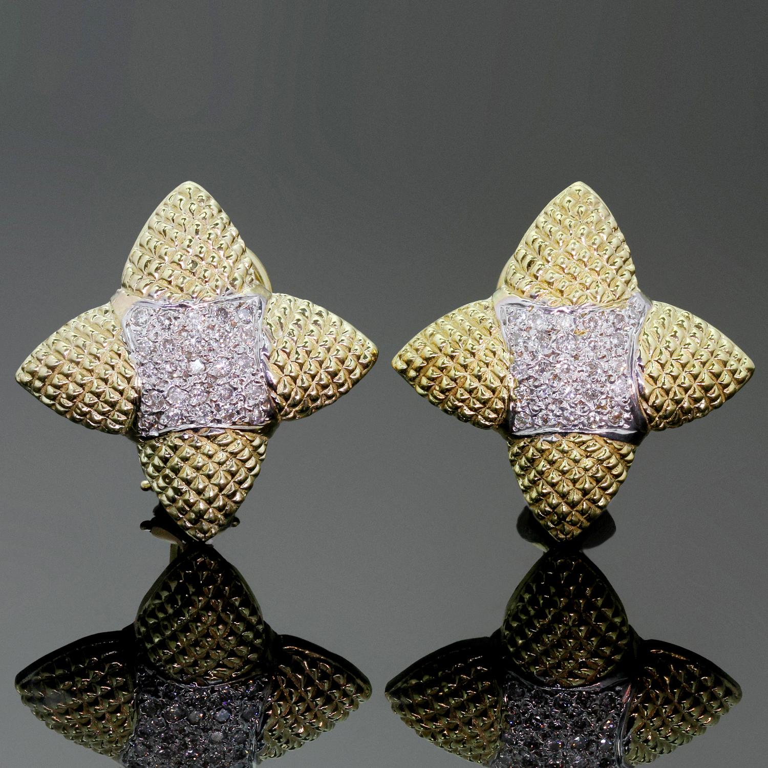 These classic retro earrings features a four-pointed star design crafted in textured 18k yellow gold and pave-set with brilliant-cut round G-H VS2-SI1 diamonds of an estimated 0.50 carats. Made in United States circa 1960s. Measurements: 1.02