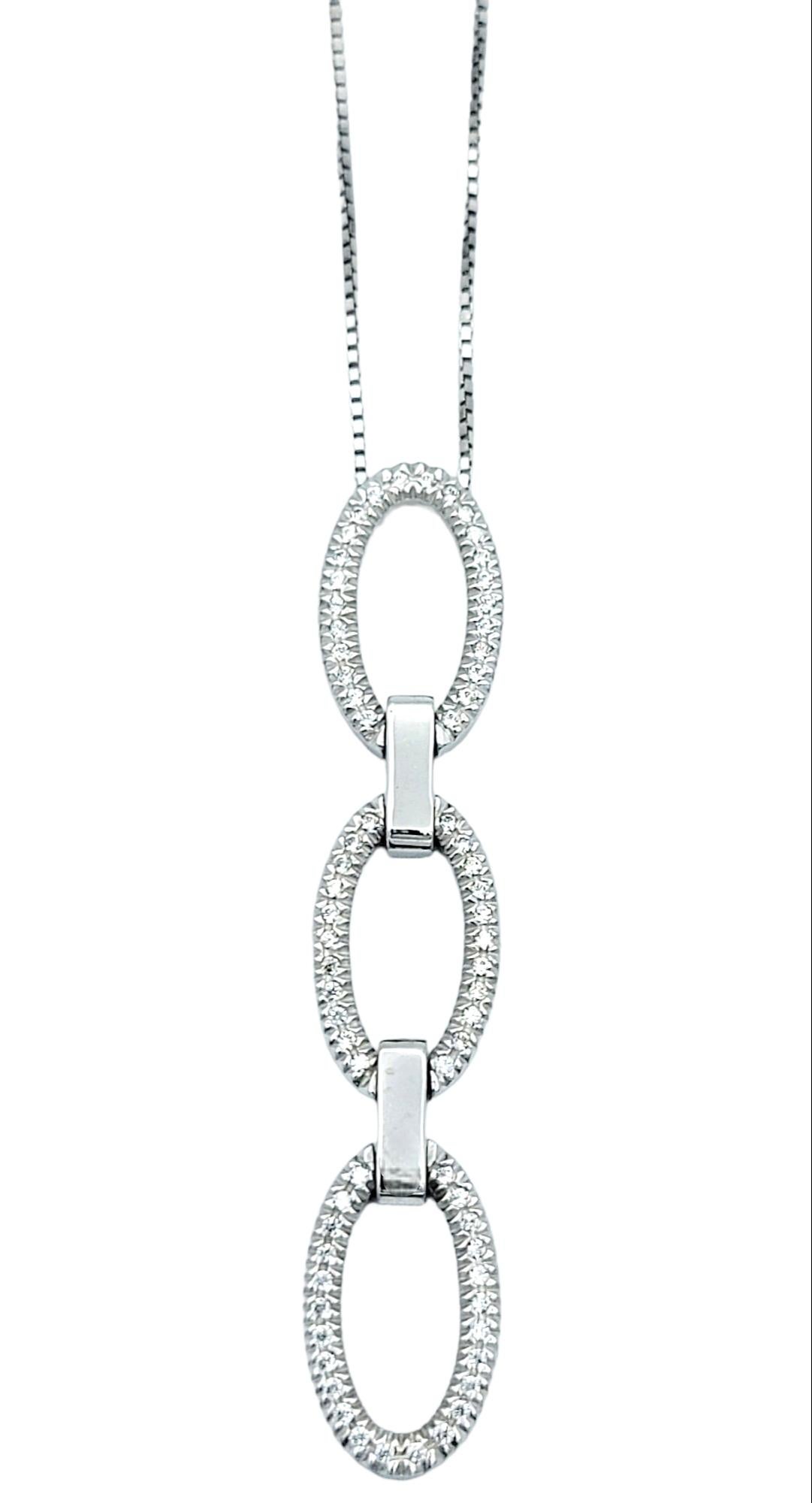 Introducing this stunning pave diamond pendant necklace, a true embodiment of elegance and luxury. Crafted in luxurious 14 karat white gold, this necklace showcases a captivating contemporary design that seamlessly blends modern aesthetics with