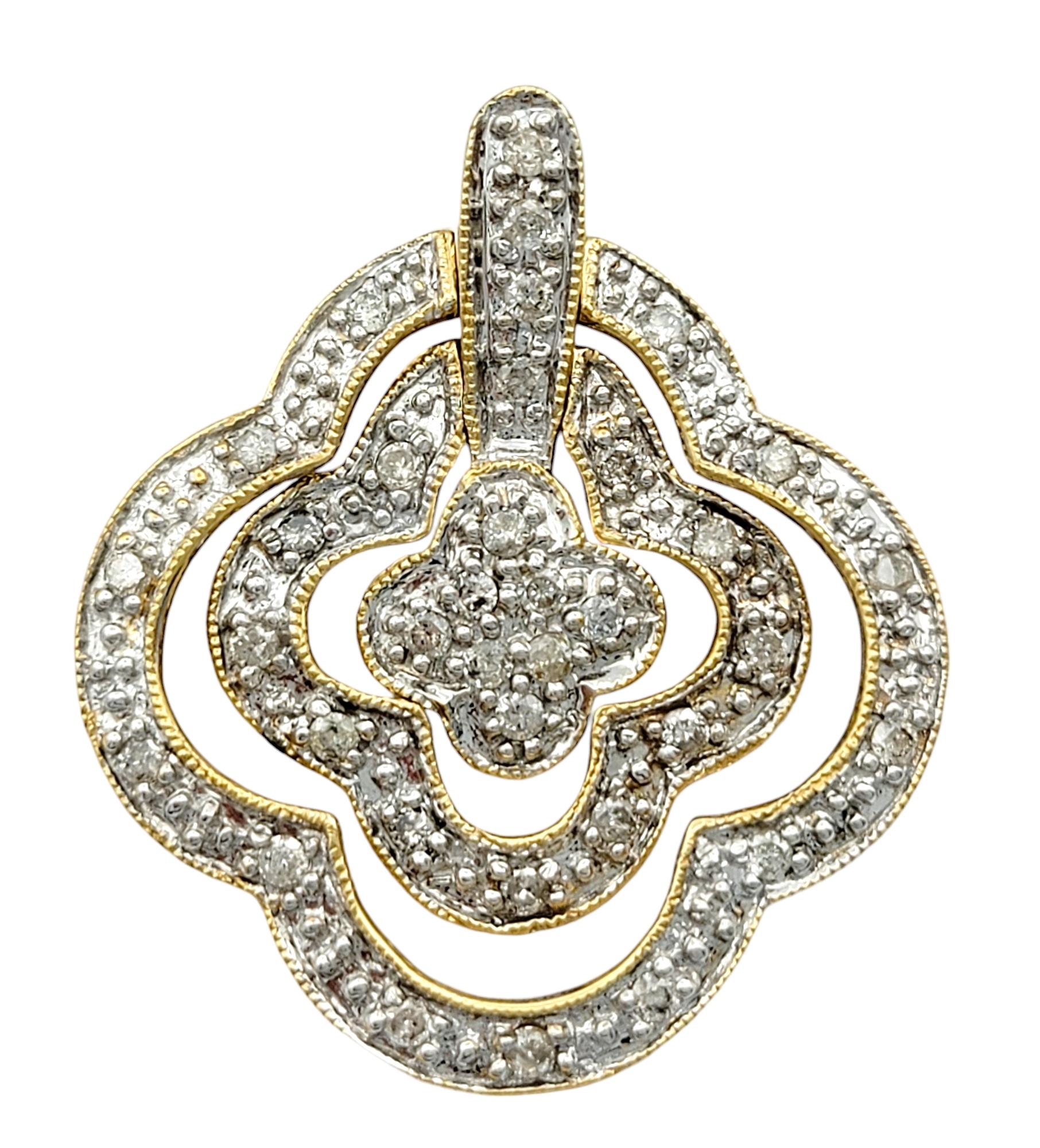 Embrace timeless elegance with these breathtaking pavé diamond quatrefoil dangle earrings, expertly crafted in luminous 10 karat yellow gold. Each earring features a delicate quatrefoil motif—a symbol of luck, balance, and beauty—outlined with a