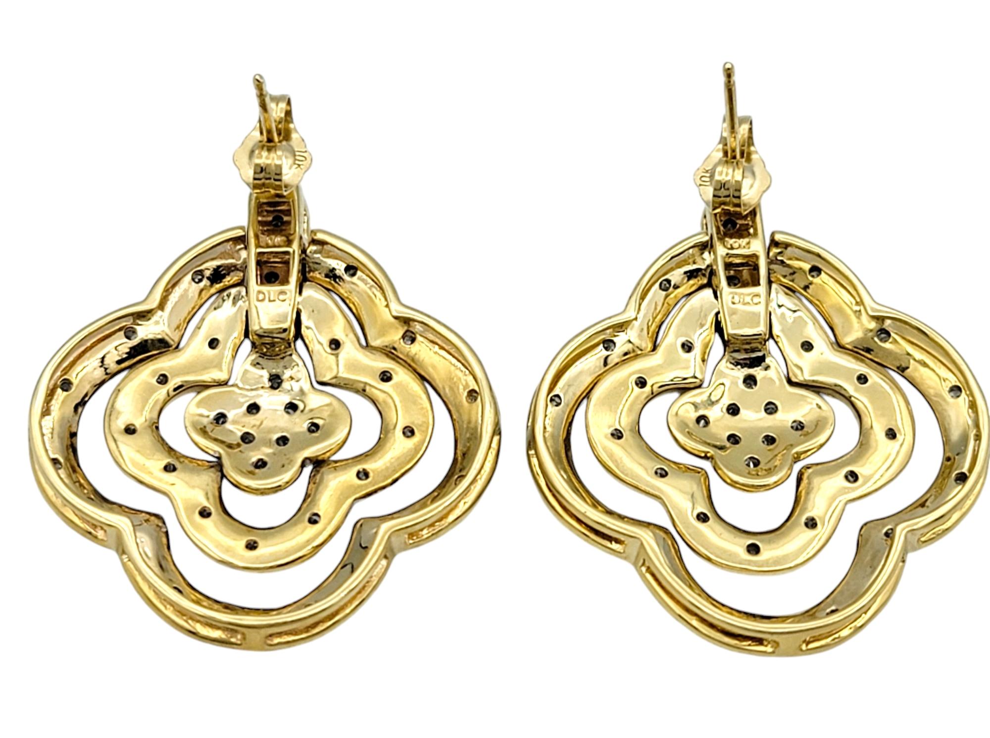 Round Cut Pavé Diamond Triple Quatrefoil Hinged Dangle Earrings in Polished Yellow Gold For Sale