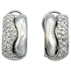 Pavé Diamond Wave Motif Omega Back Earrings in Polished 14 Karat White Gold