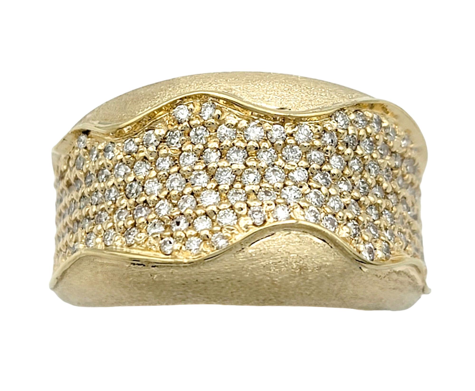 Ring Size: 8.5

This pavé diamond band ring exudes a sense of fluidity and elegance with its wavy design, beautifully crafted in 14 karat yellow gold. The sinuous curves of the ring create a dynamic and organic feel, reminiscent of gentle waves on
