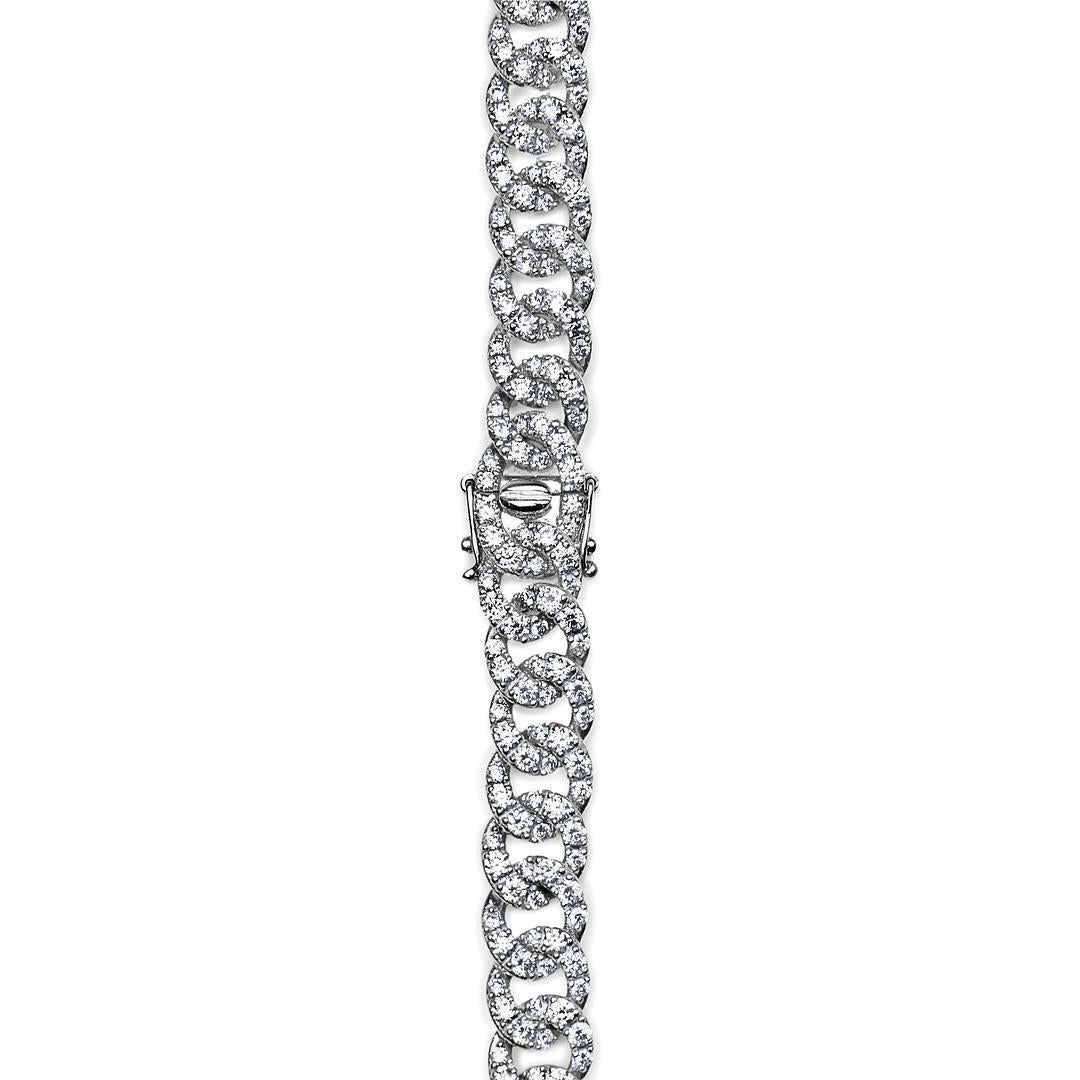 Experience the epitome of sophistication with the White Gold Chain Necklace adorned with Pave Diamonds.

The centerpiece of this exquisite piece is an array of pave diamonds meticulously set along the chain, totaling an impressive 12.68 carats. Each