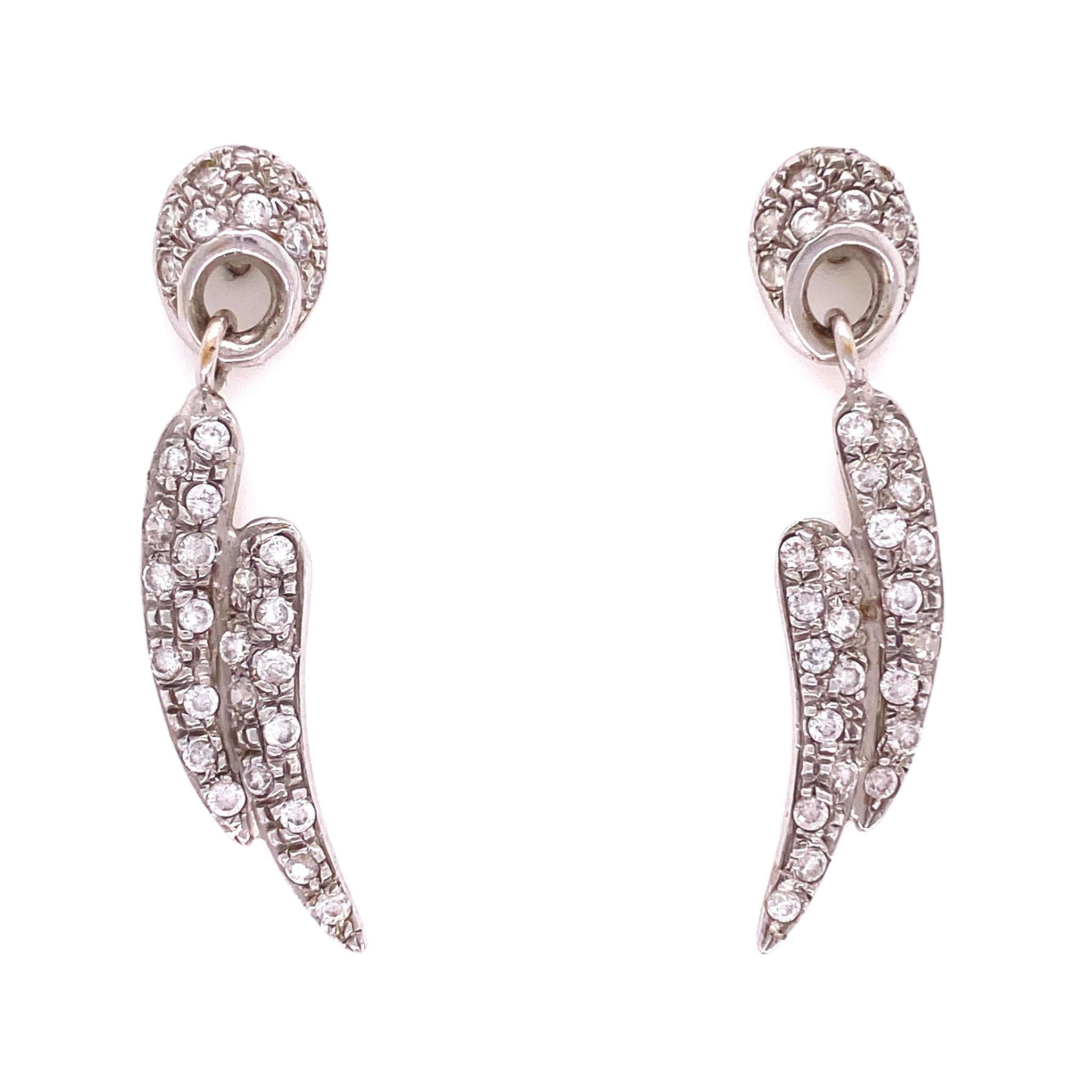 Simply Beautiful! Stylish Pave Diamond Gold Vintage Dangle Drop Earrings. Hand set Diamonds, weighing approx. 1.00tcw. Hand crafted Wing design in 14K White Gold. Post system. Measuring approx. 1.80” Long. More Beautiful in Real time! Sure to be