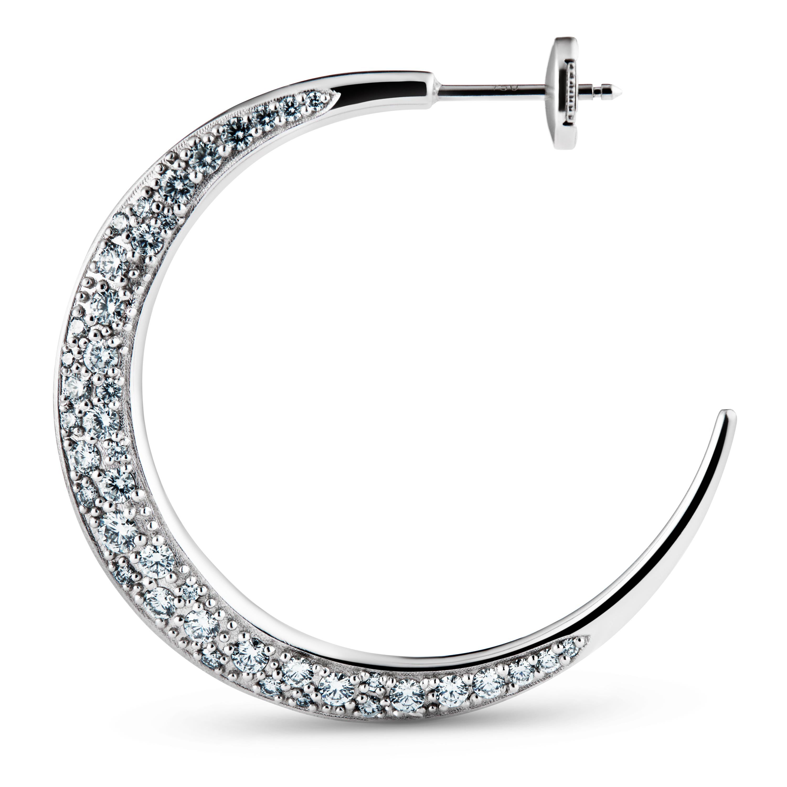 The XL Diamond Hoops in 18k white gold are  hand set with 84 diamonds, a total of 1.5 carat, brilliant cut traceable diamonds.

Each of the 84 diamonds are hand set so they underline the shape of the earring providing the perfect sparkle and light