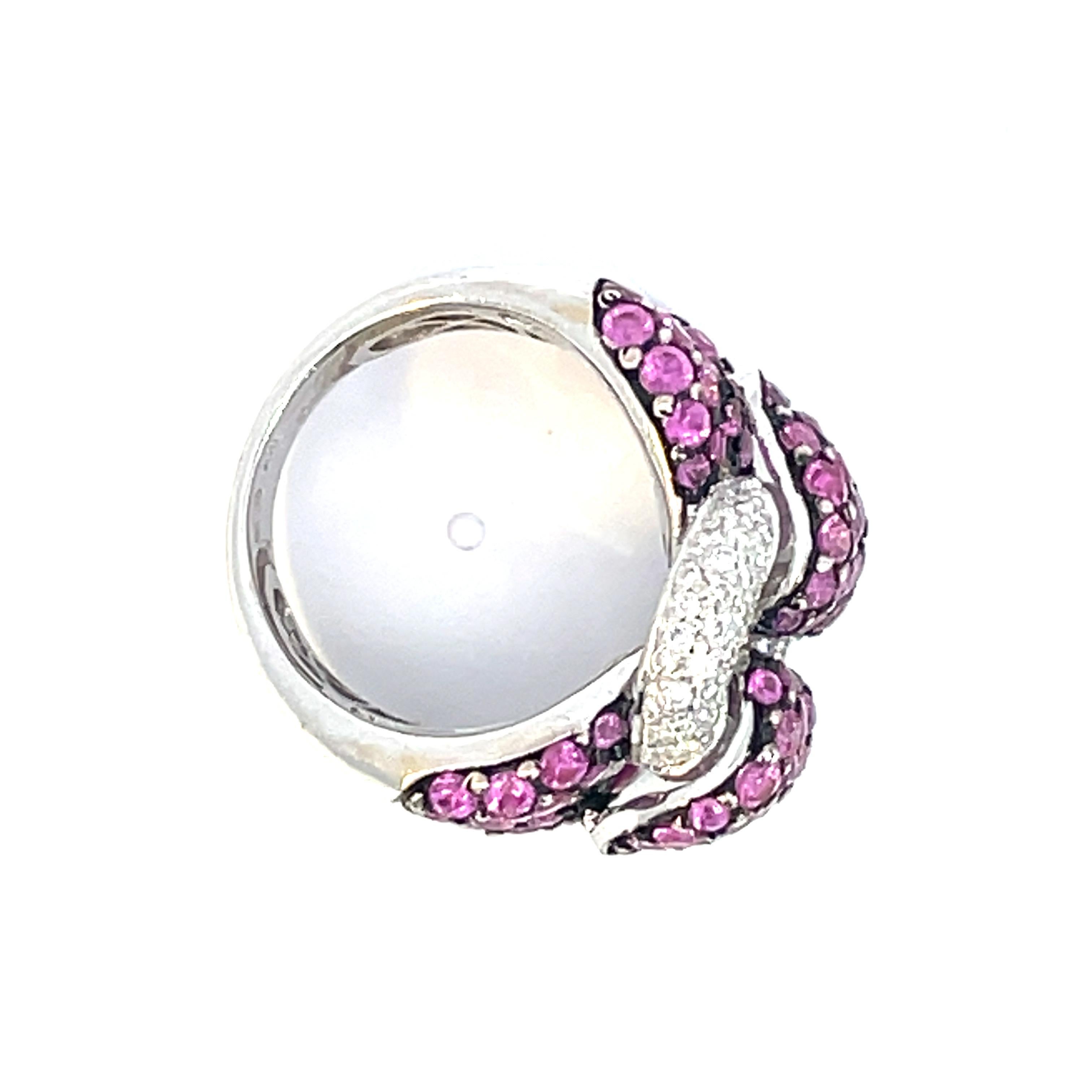 One natural pink sapphire  & natural white diamond Ribbon Ring meticulously set with fine pink sapphires accented by a black rhodium finish to bring out the colour and only the finest quality brilliant cut diamonds. The best accessory to make any