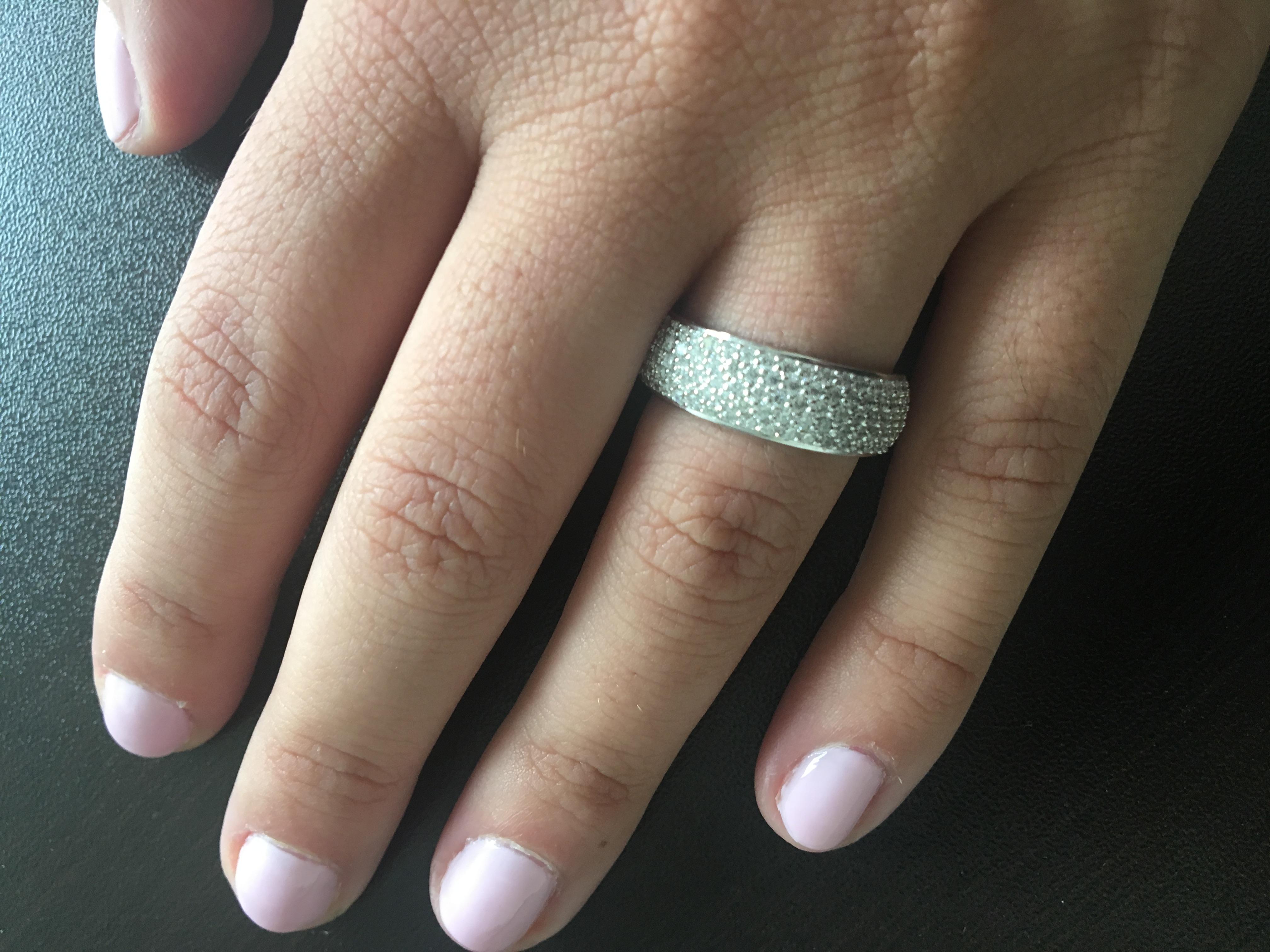 Half-way pave ring set in 14k white gold. The ring consists of 5 rows of diamonds at 0.01 carats each stone approx. The total weight is 1.10 carats. The color is G and the clarity is SI. This is a classic look that you can wear in any occasion and