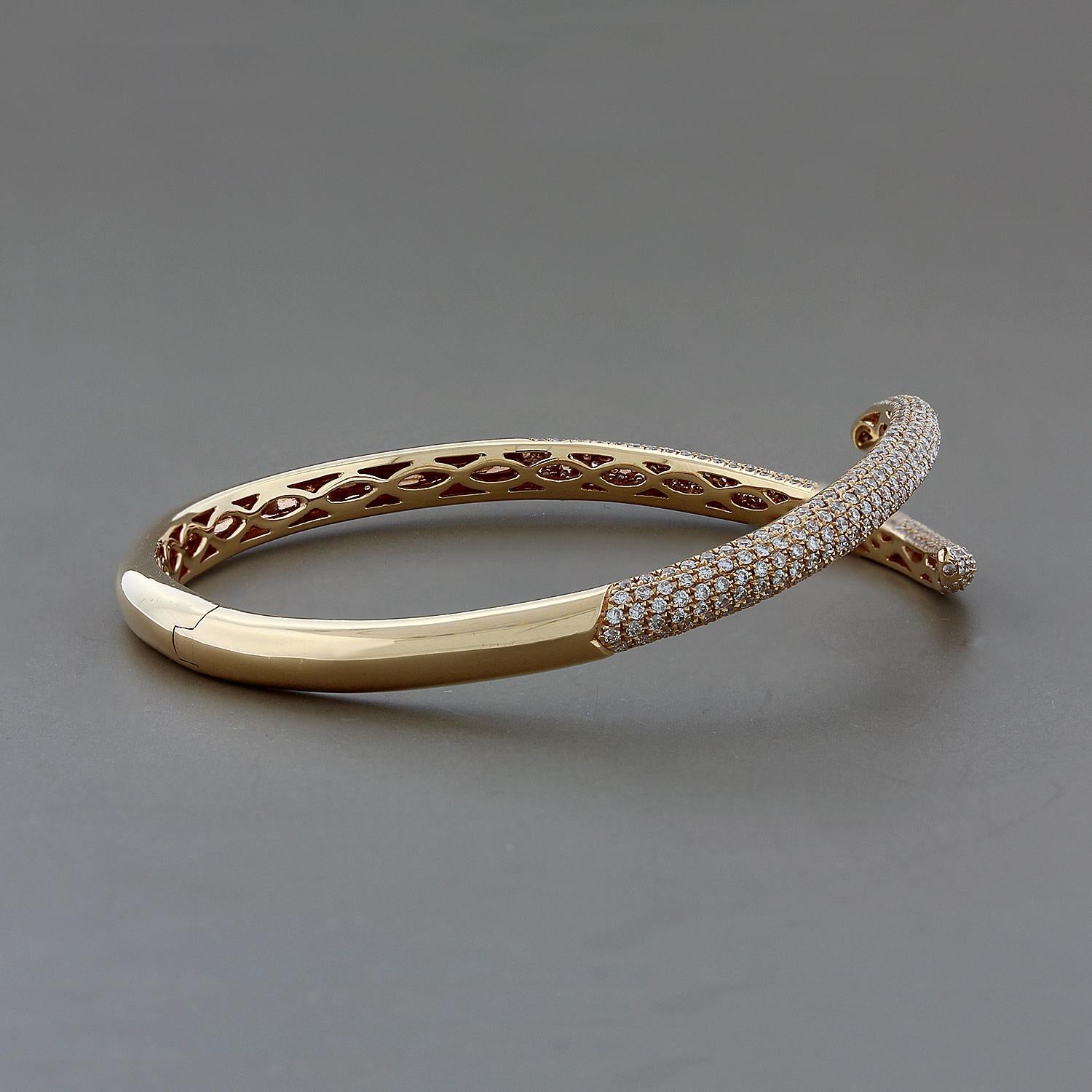 An amusing cuff with snake tails featuring 2.58 carats of VS quality round cut diamonds pave set in 18K rose gold. A sleek and stylish cuff. 

Fits wrists up to 7.50 inches