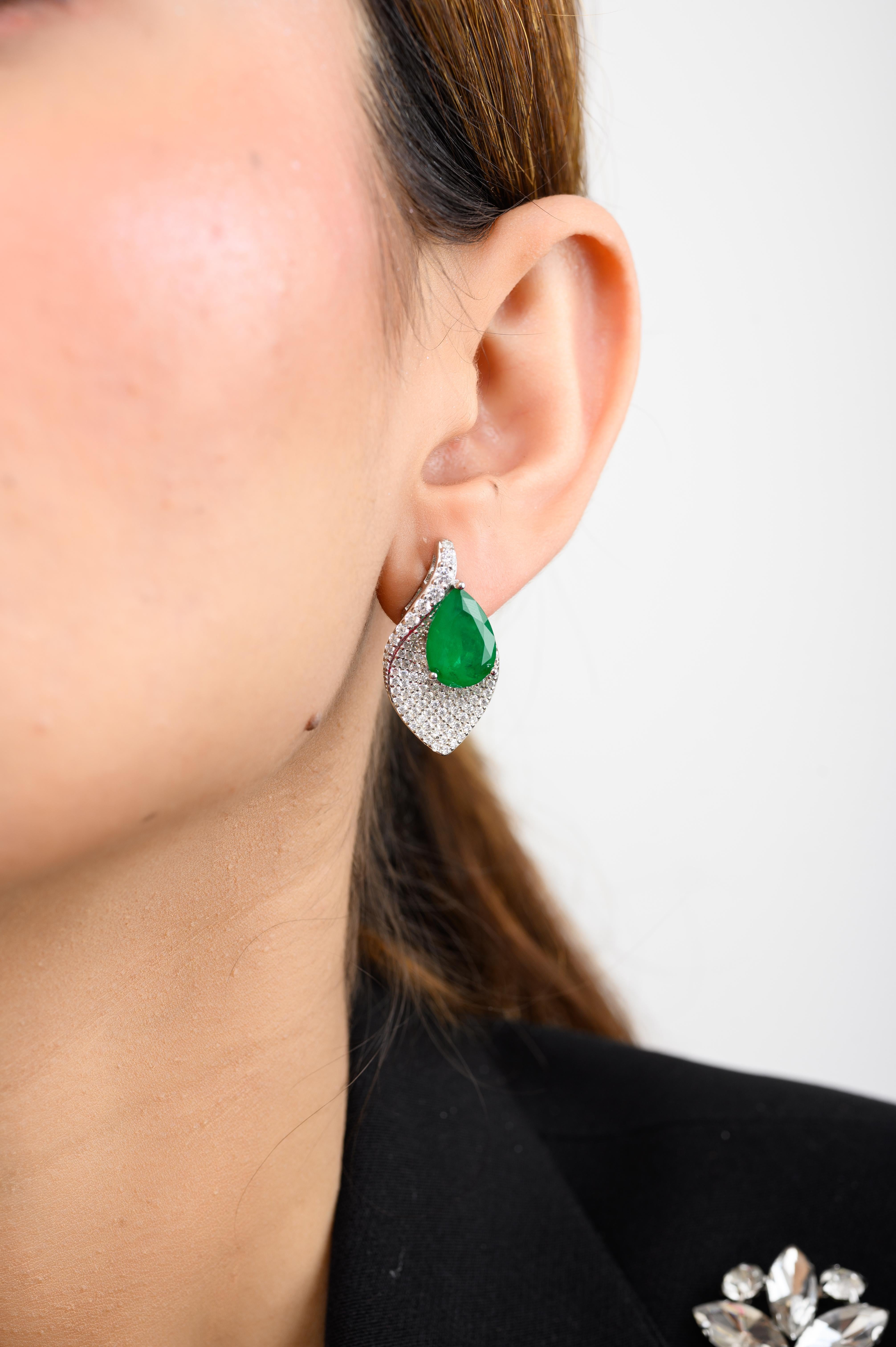 Pave Set CZ and Green Pear Leaf Shape Stud Earrings in sterling silver. You shall need stud earrings to make a statement with your look. Each piece features dazzling cubic zirconia stones, renowned for their brilliance and clarity, set in