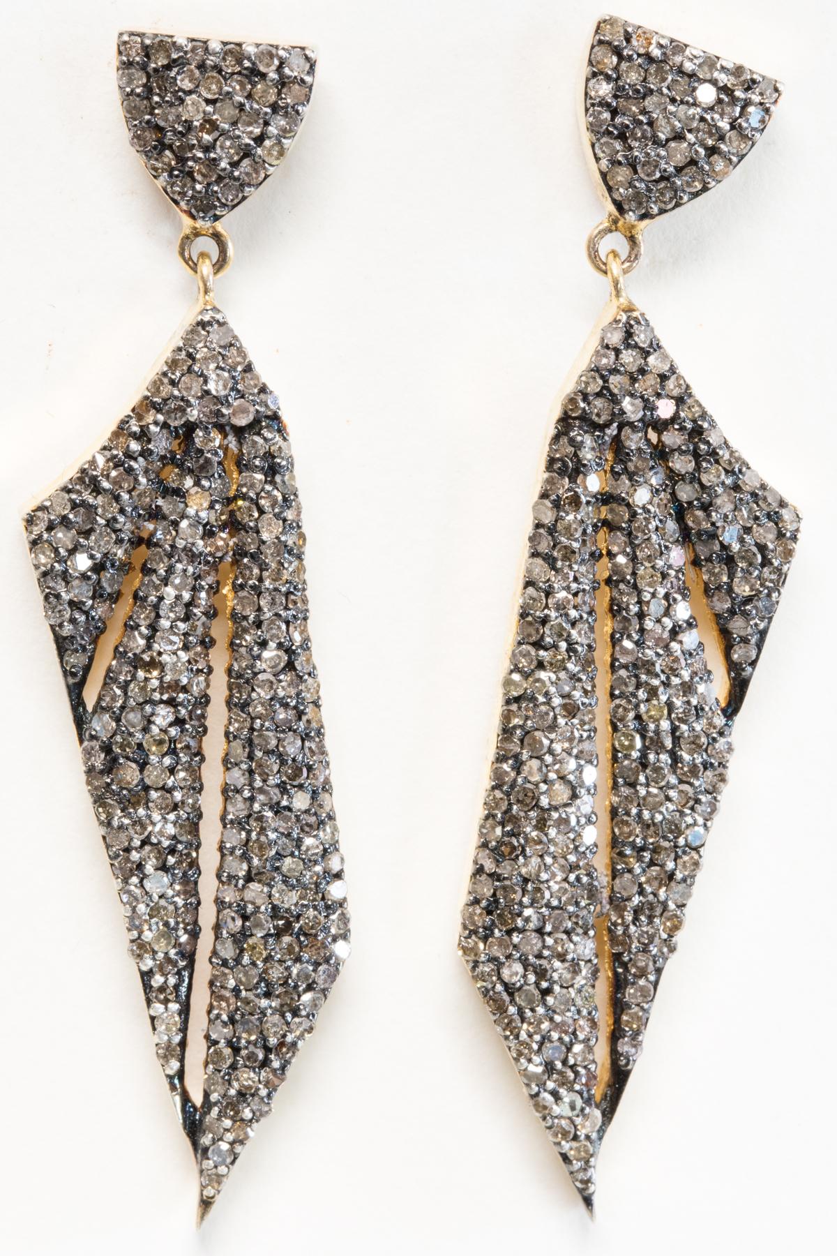 Pair of pave`-set diamond earrings in sterling silver and plated gold.  18K gold post for pierced ears.  2.73 carats of diamonds. Unusual shape and setting.