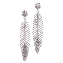 Boucles d'oreilles plumes en diamant serti de pavés