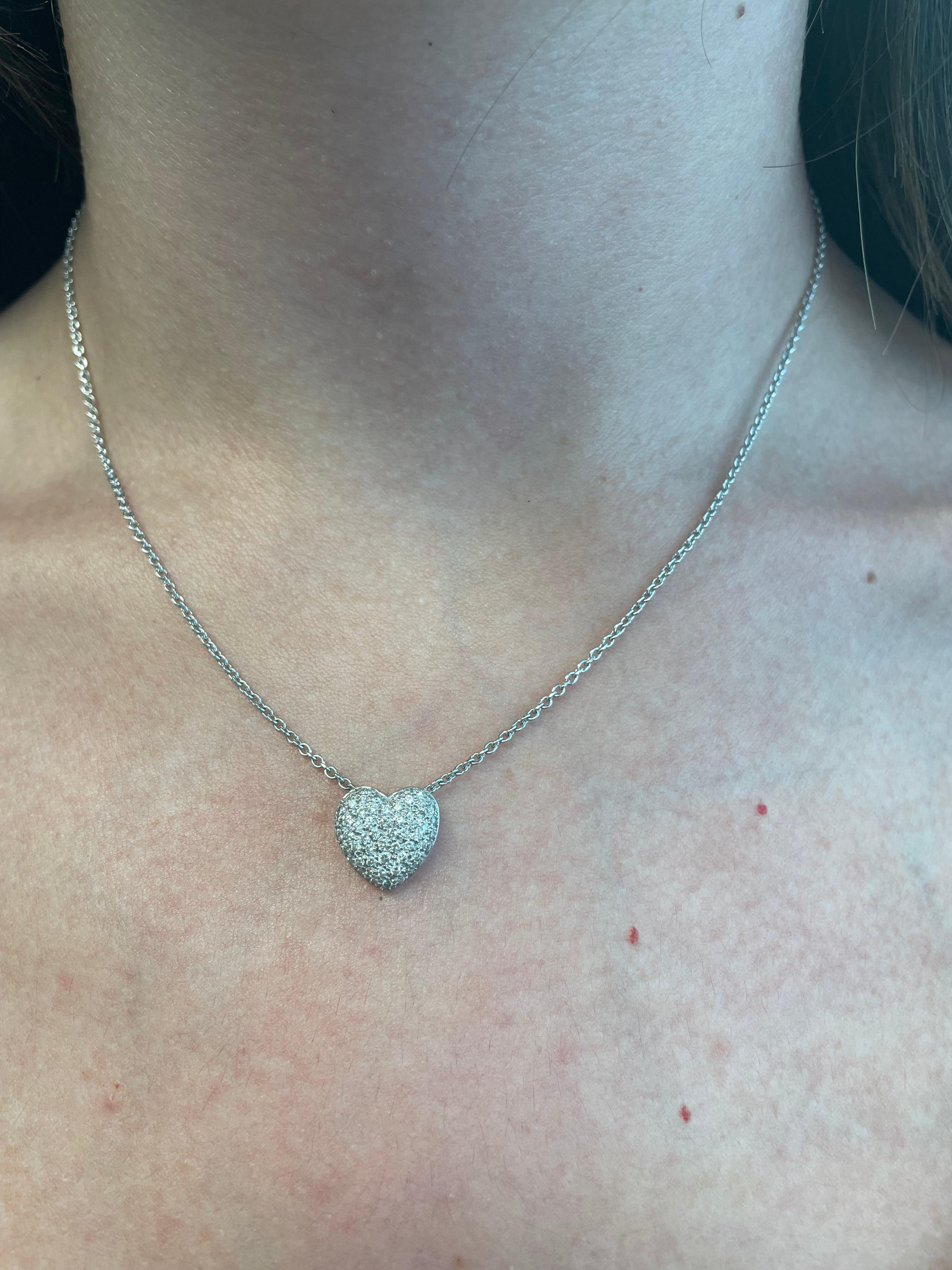 Beautiful modern pave set diamond heart pendant.
60 round brilliant diamonds, 0.69 carats. Approximately H/I color and SI clarity. 18-karat white gold, 16in.
Accommodated with an up-to-date digital appraisal by a GIA G.G. once purchased, upon