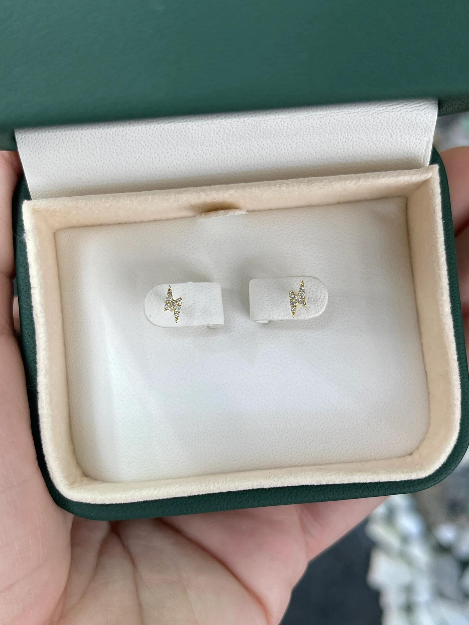 A cute and dainty pair of lightning bolt stud earrings. Natural diamonds pave set in a 14K gold setting, in the color of your choice. Perfect for everyday wear or stacking!

Setting Style: Pave
Setting Material: 14K Yellow/White/Rose Gold

Main