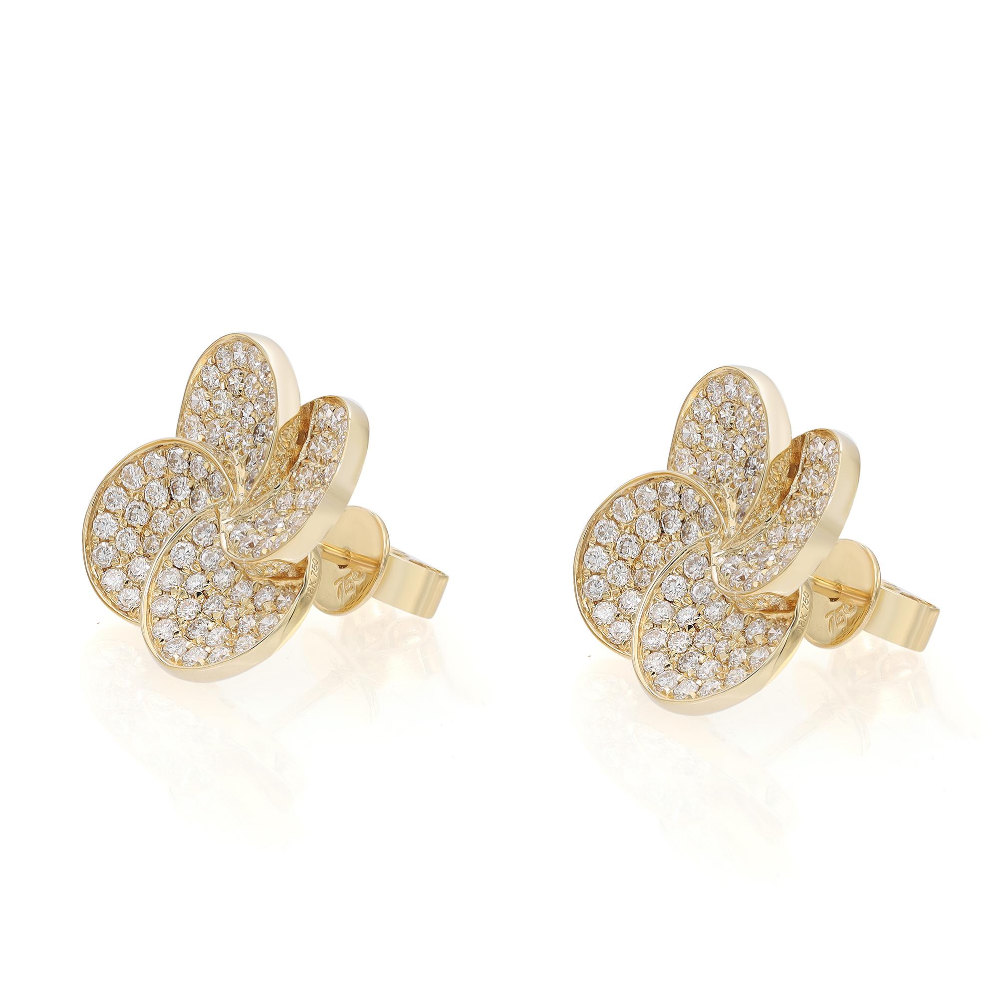 Diamonds in full bloom. These stunning diamond flower stud earrings are crafted in 18k yellow gold. Showcases pave set round brilliant cut diamonds weighing 1.45 carats. Diamond quality: color G-H and clarity VS-SI. Earring size: 14mm x 14mm. Total