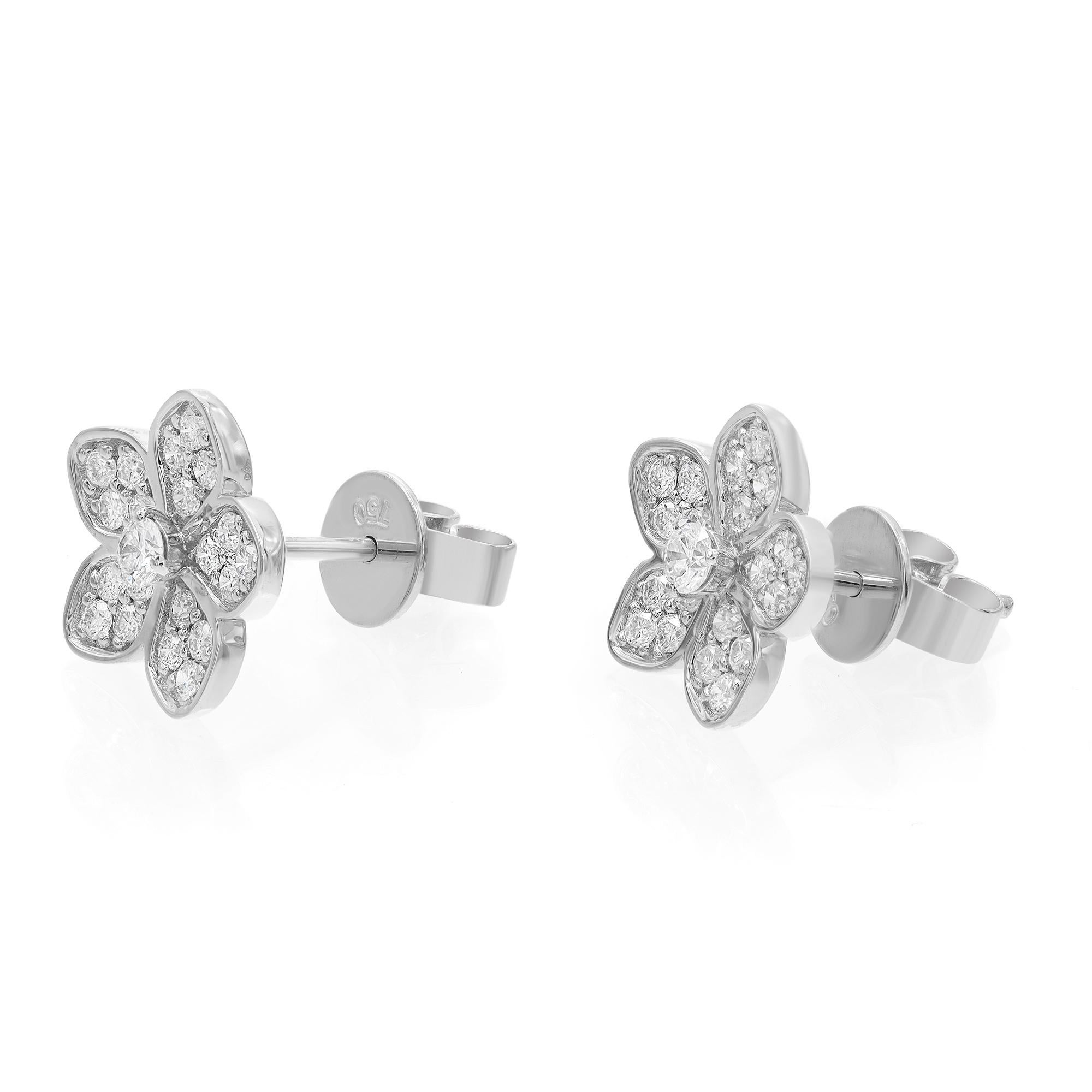These fanciful flowers are reminiscent of springtime blooms. Featuring diamond flower stud earrings crafted in 18k white gold. These earrings are encrusted with pave set round brilliant cut diamonds weighing 0.52 ct. Diamond quality: color G-H and