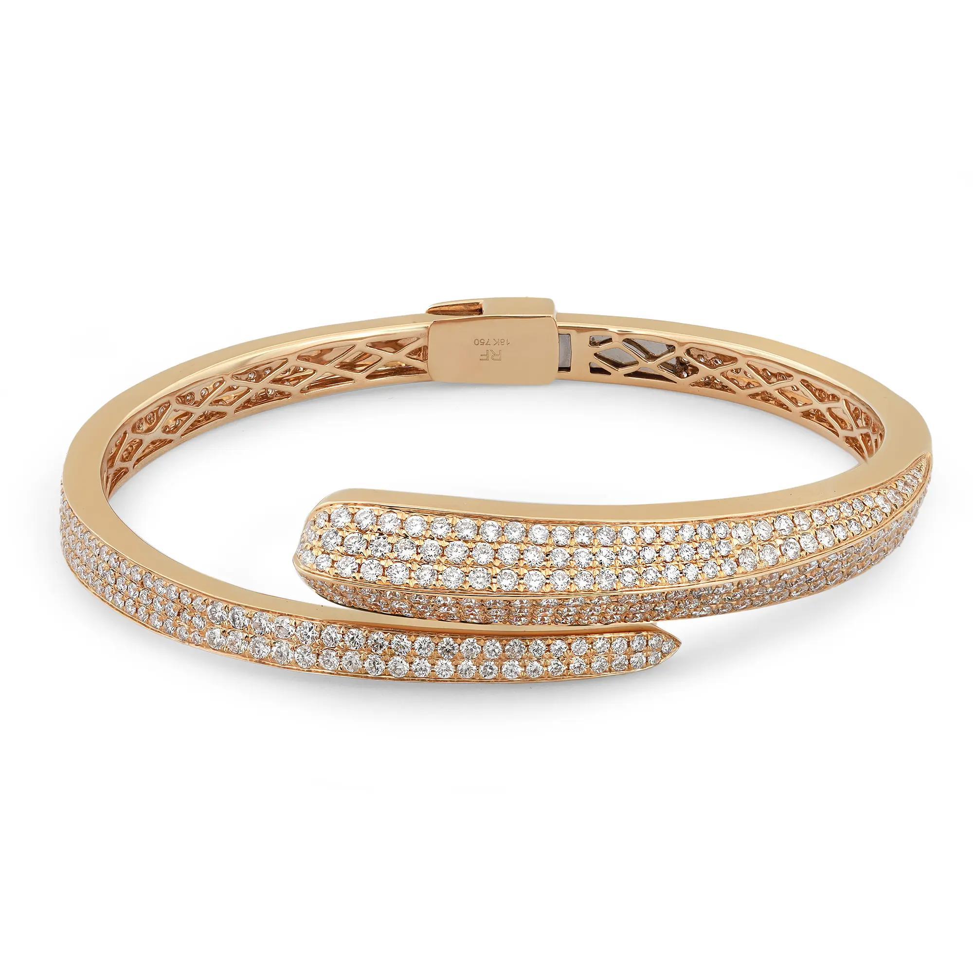 Let your style shine with this fancy and elegant diamond spiral bangle bracelet. It features pave set round brilliant cut diamonds weighing 4.31 carats. Crafted in high polished 18K yellow gold. Diamond Quality: G-H color and VS-SI clarity. The
