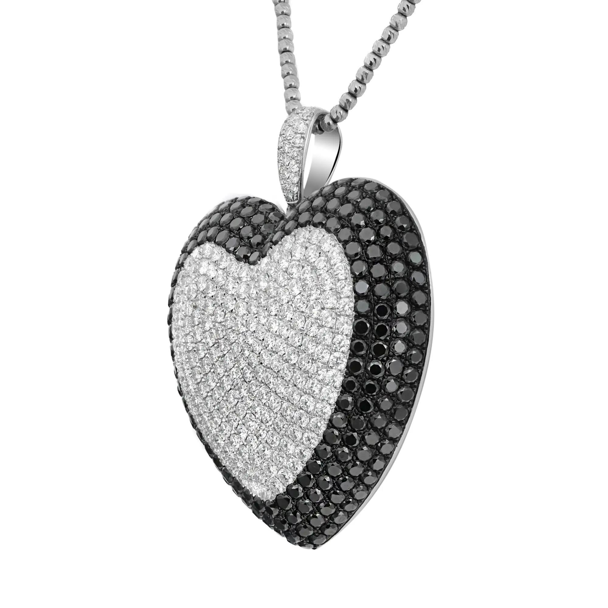 This beautiful, chunky and bold diamond pendant necklace will leave everyone speechless the moment they see it. Crafted in high polished solid 18k white gold. The heart pendant is encrusted with round brilliant cut white diamonds in the center with