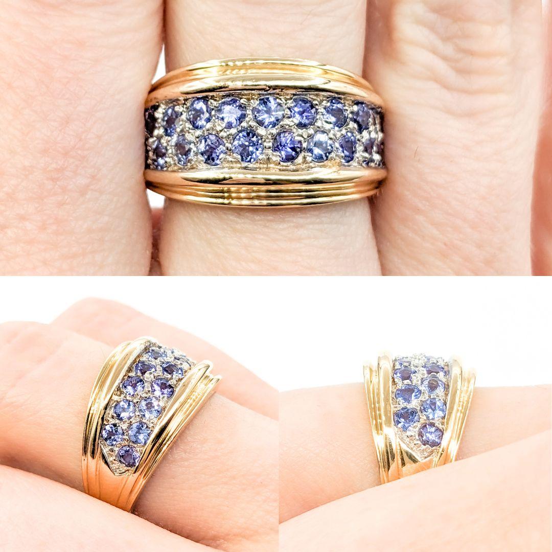 Pave Tanzanite Ring In Yellow Gold

Introducing this exquisite gemstone ring crafted in 14kt yellow gold. The ring features a captivating .80ctw round Tanzanite centerpiece, known for its deep blue-violet hues that symbolize sophistication and