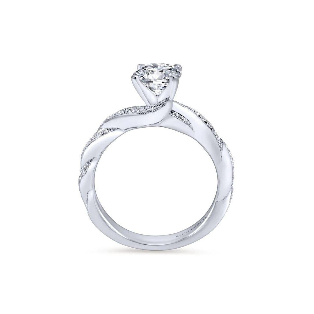 Ladies' 14k White Gold Diamond  Engagement Mounting﻿. Diamond pave weaves into the ring's shank and extends to the sides of the center stone to give this one of a kind ring a romantic appeal. Center diamond NOT included. Side diamonds 0.30 ctw, H