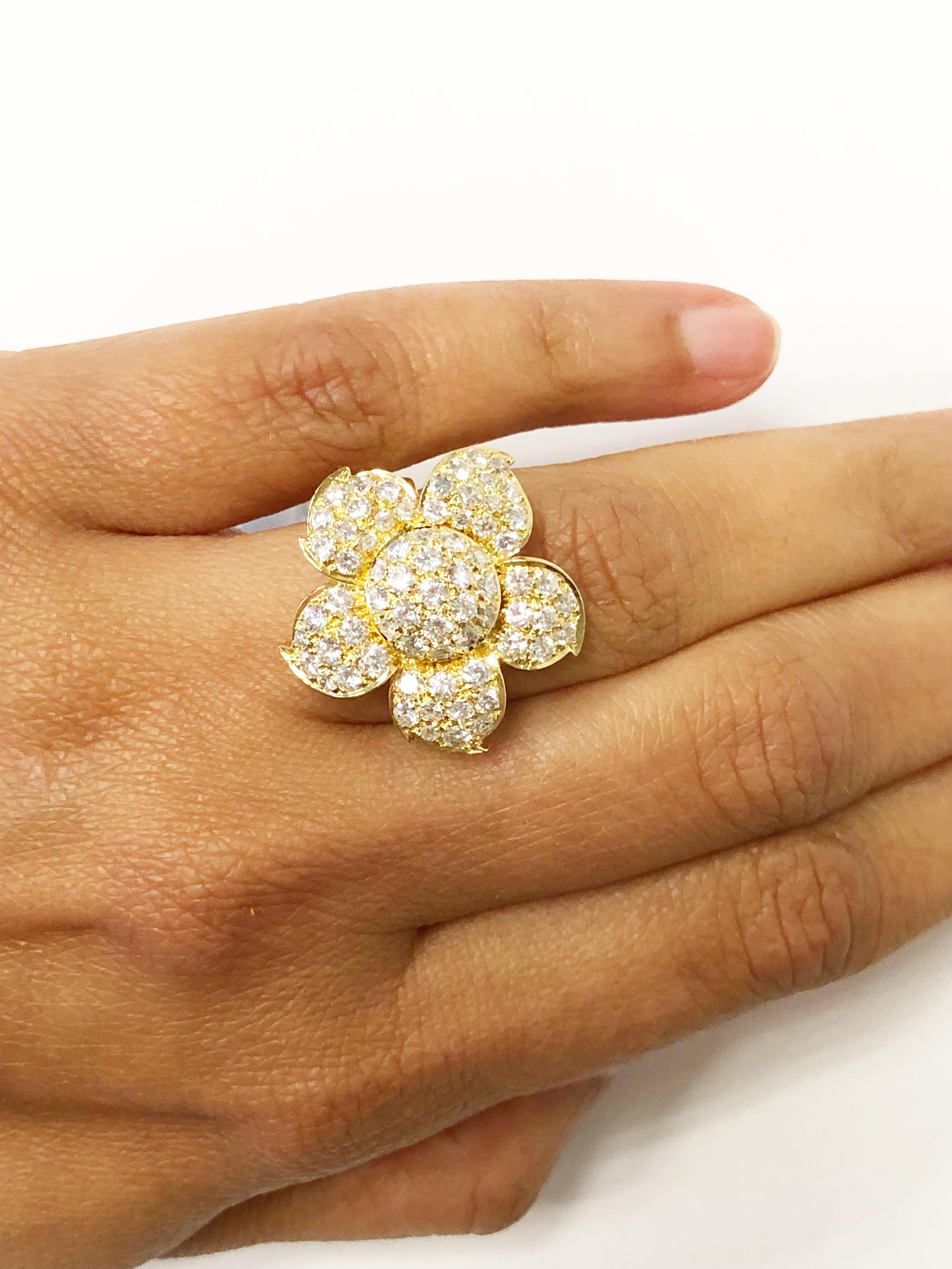 Splendid white diamond pave flower ring in 18k yellow gold size 6.25.  Bright good quality diamonds weighing 2.10 carats in a handmade mounting.  Delicate and feminine, this flower ring is perfect for any occasion!


