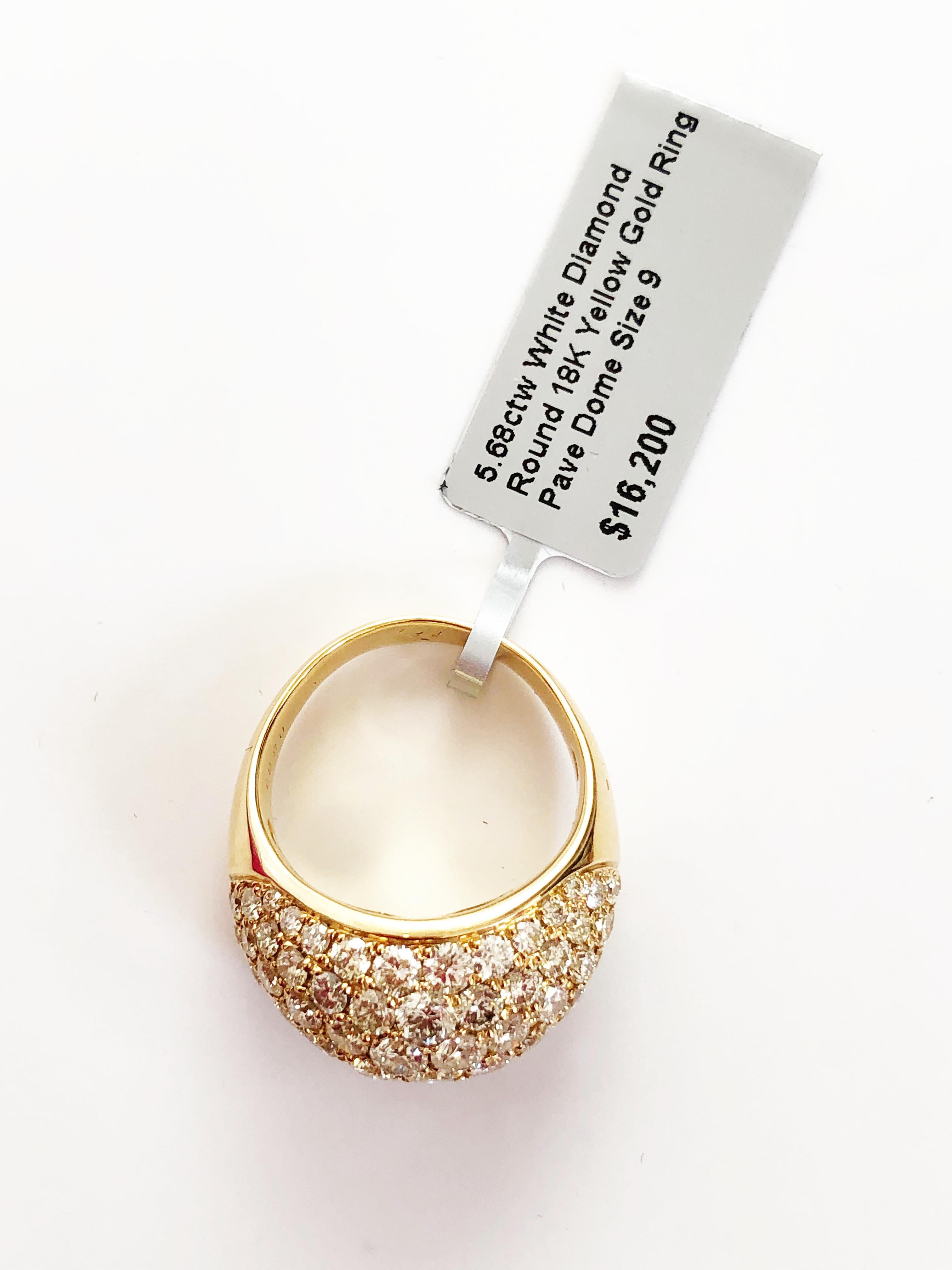 Beautiful pave white diamond rounds weighing 5.68 carats in 18k yellow gold.  Handmade in size 9.  This cocktail ring is always going to be in fashion with it's evergreen design.  Perfect to add a little spunk to any outfit.