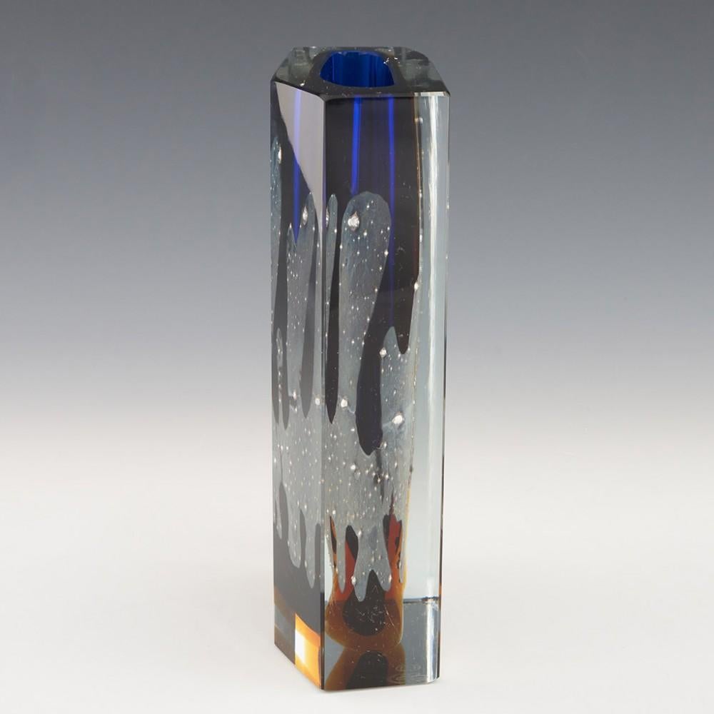 Heading : Exbor Pavel Hlava galaxy vase
Date : c1964
Origin : Czechoslovakia
Bowl Features : Blue and amber glass cased in clear. There is a pale grey irregular pattern formed with silver inclusions reminiscent of the milky way on a clear night. The