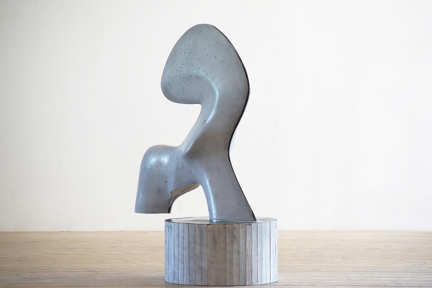 Glass fiber reinforced concrete sculpture, 130 cm × 100 cm × 58 cm. Unique work.
This sculpture is a representation of the moon, filtered by the artist’s imaginary vision giving it sinuous and organic forms. The black dots on the sculpture are