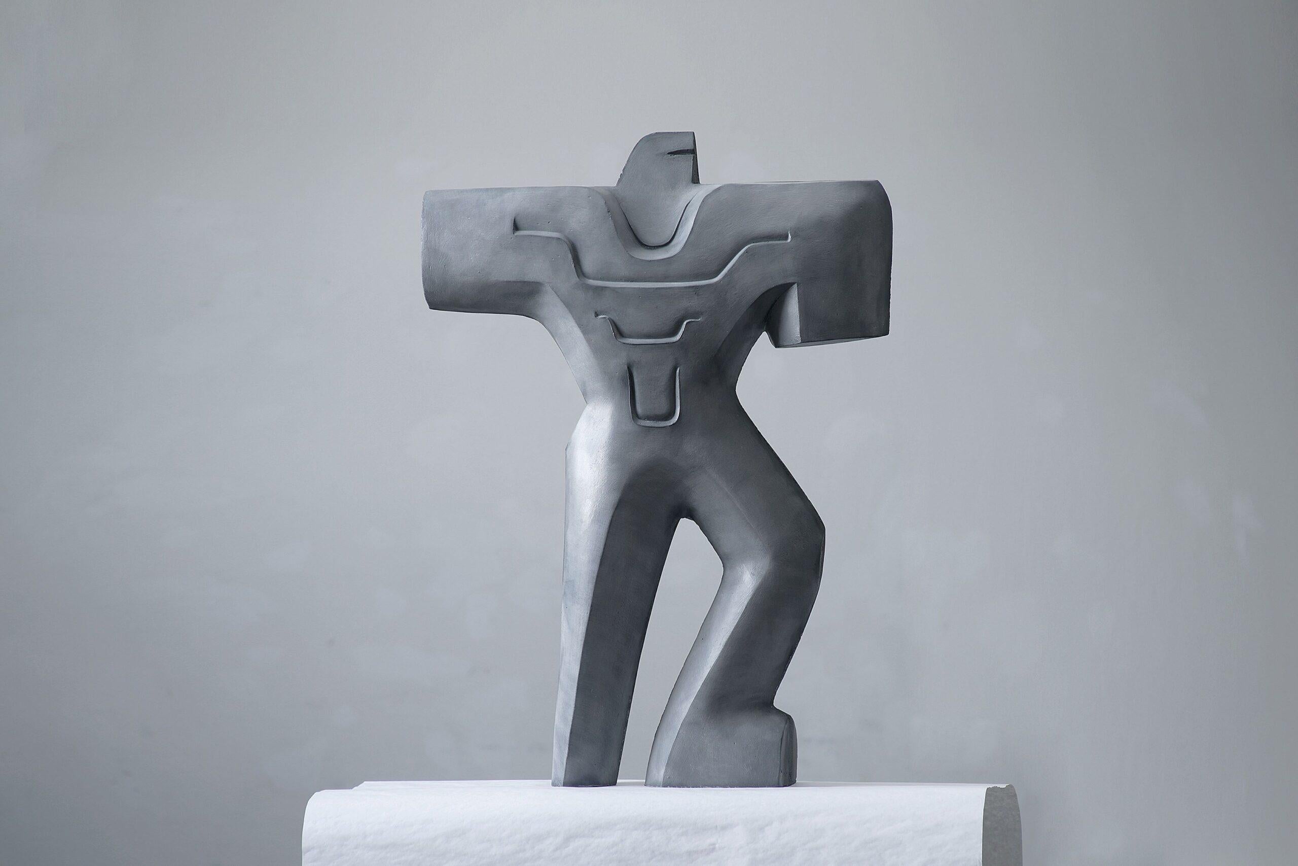 Warrior in Armor is a glass fiber reinforced concrete or coloured artificial stone sculpture by contemporary artist Pavlína Kvita, dimensions are 87 × 63 × 14 cm (34.3 × 24.8 × 5.5 in). The dimensions of a steel plinth are 120 cm (47.2 in). The