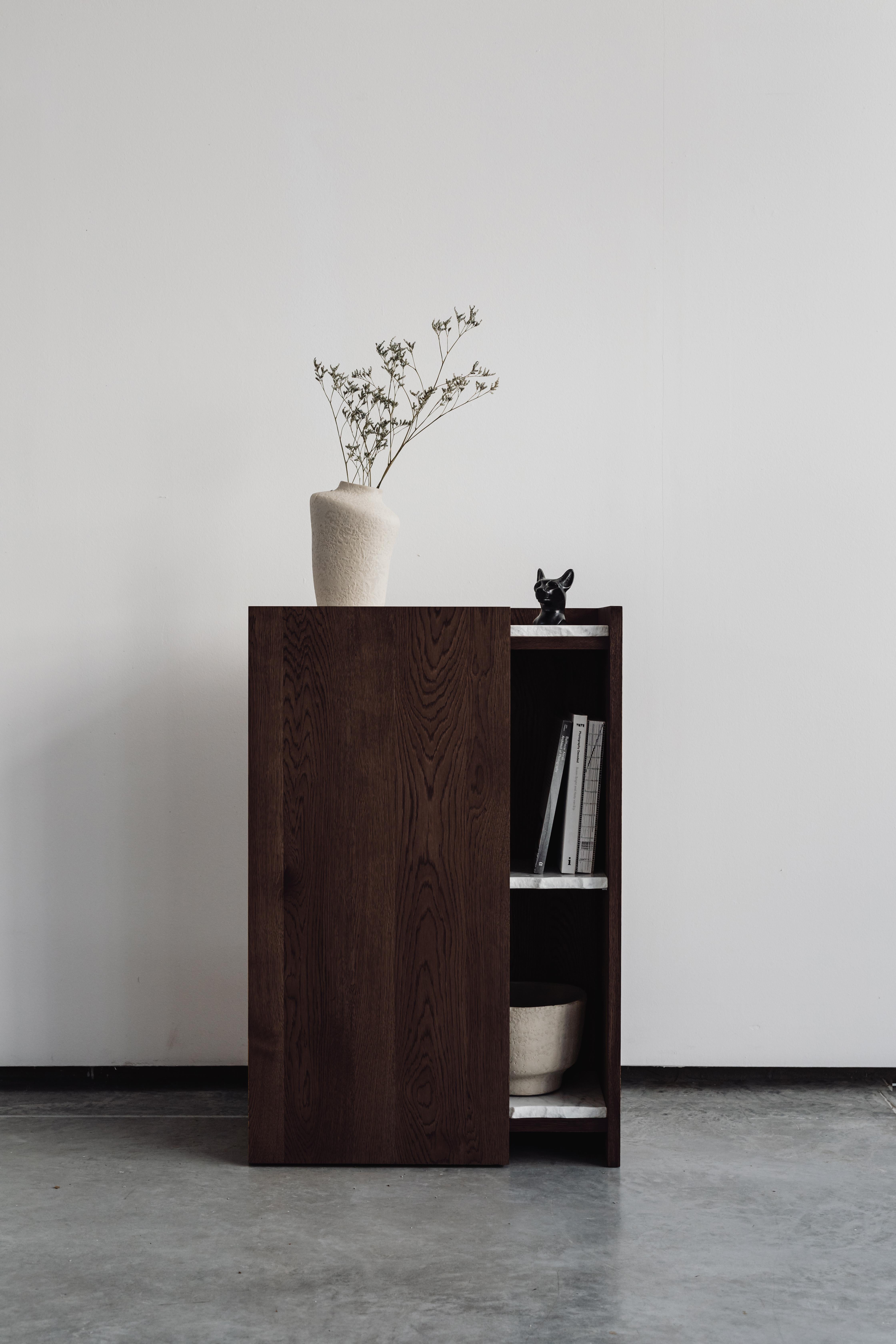 Pavo Console Table by Un’common
Designed by Małgorzata Korycka.
Dimensions: D 30 x W 60 x H 90 cm.
Materials: Carrara marble and dark oak.

Available in different oak finishes: raw, smoky, dark, and graphite. Available in three different marble