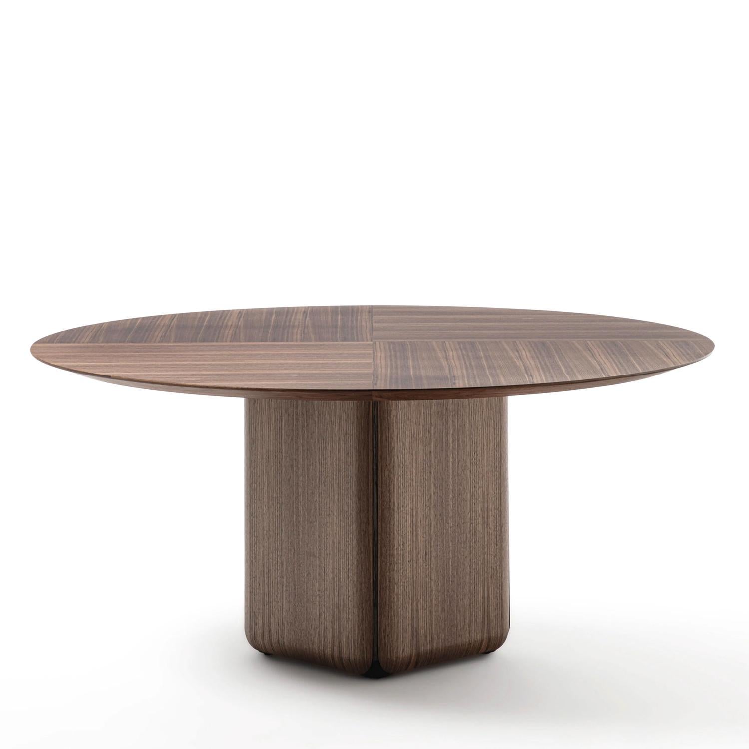 Table Pax Walnut Round with solid walnut inlaid top, base with
removable outer sections in solid walnut with inside frame in
solid ash in grey stained finish. Base with adjustable end-feet. 
With removable moulded balancing weights in concrete