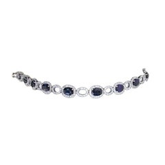 Bracciale tennis classico in oro bianco con diamante e zaffiro blu per lei