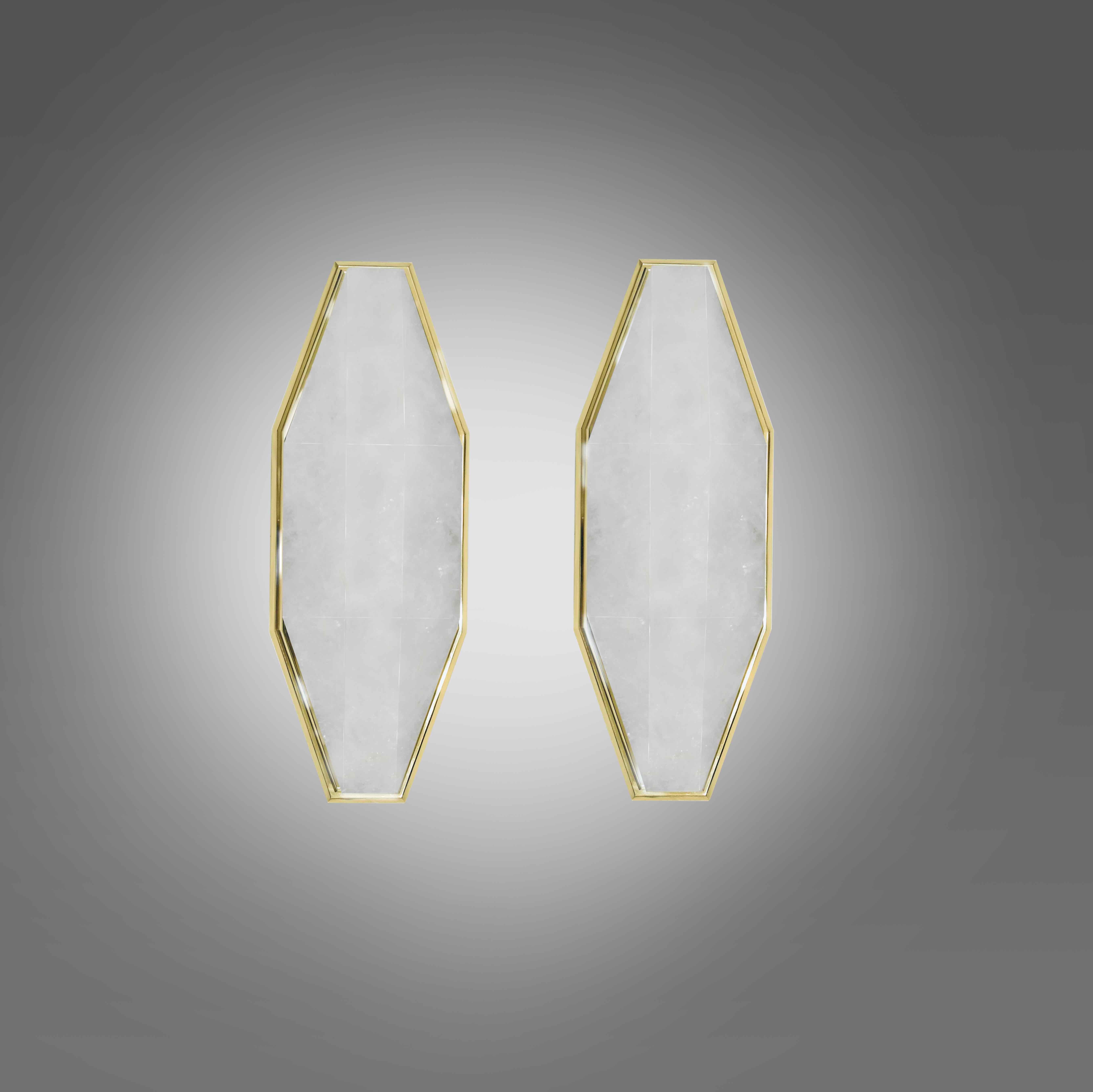 Pair of fine carved diamond form rock crystal sconces with polished brass mounts. Created by Phoenix Gallery.
Each sconce installs 2 sockets. 60 watts max each socket, the total of 120 watts maximum.
Custom size upon request.

 