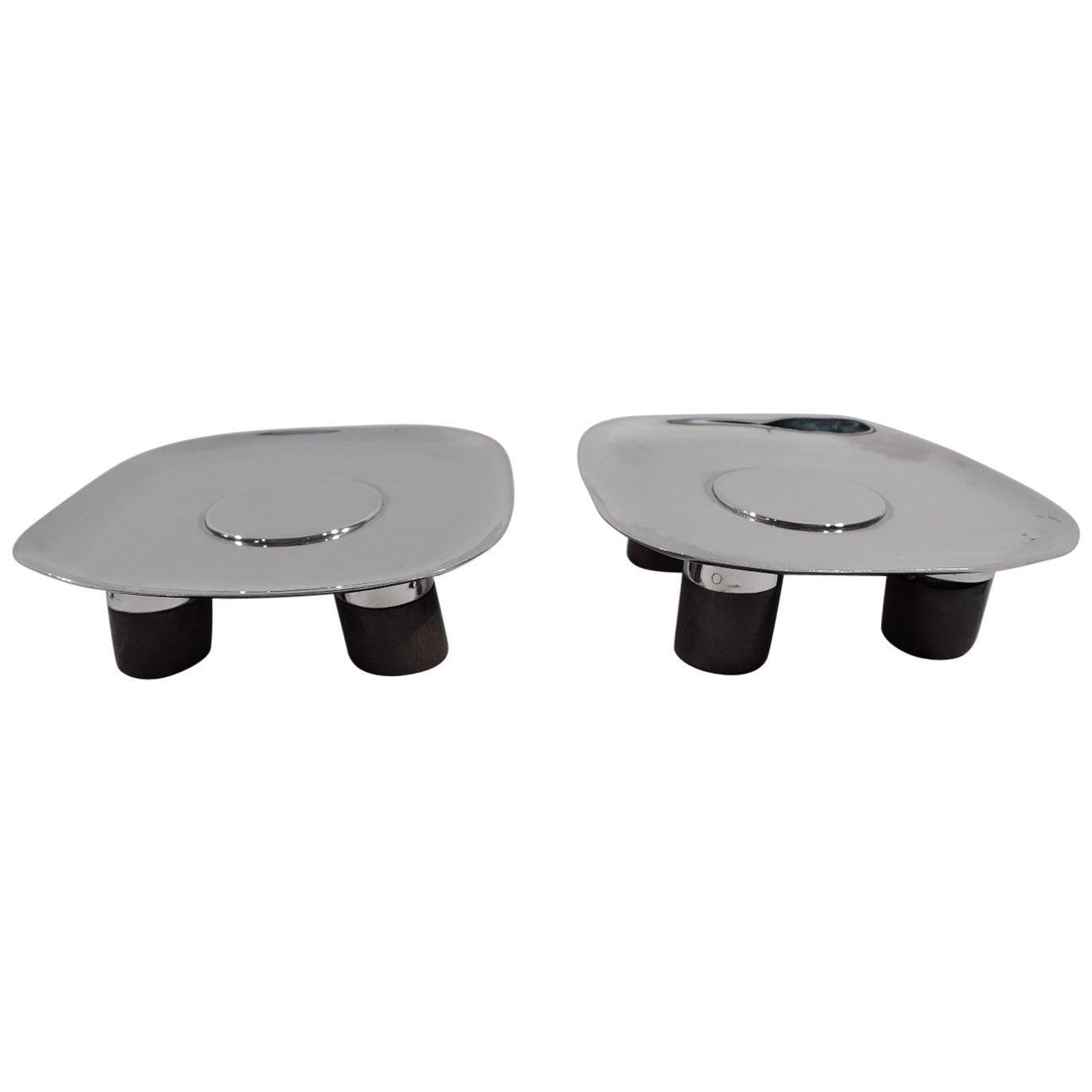 Including:

Cartier Modern Sterling Silver Serving Tray , 11 , f_21119422 , Price: $1085

Pair of Spratling Mid-Century Modern Sterling Silver Footed Dishes , 1.13 x 3.63 x 3.63 , f_21412892 , Price: $775

Cartier Mid-Century Modern Sterling Silver