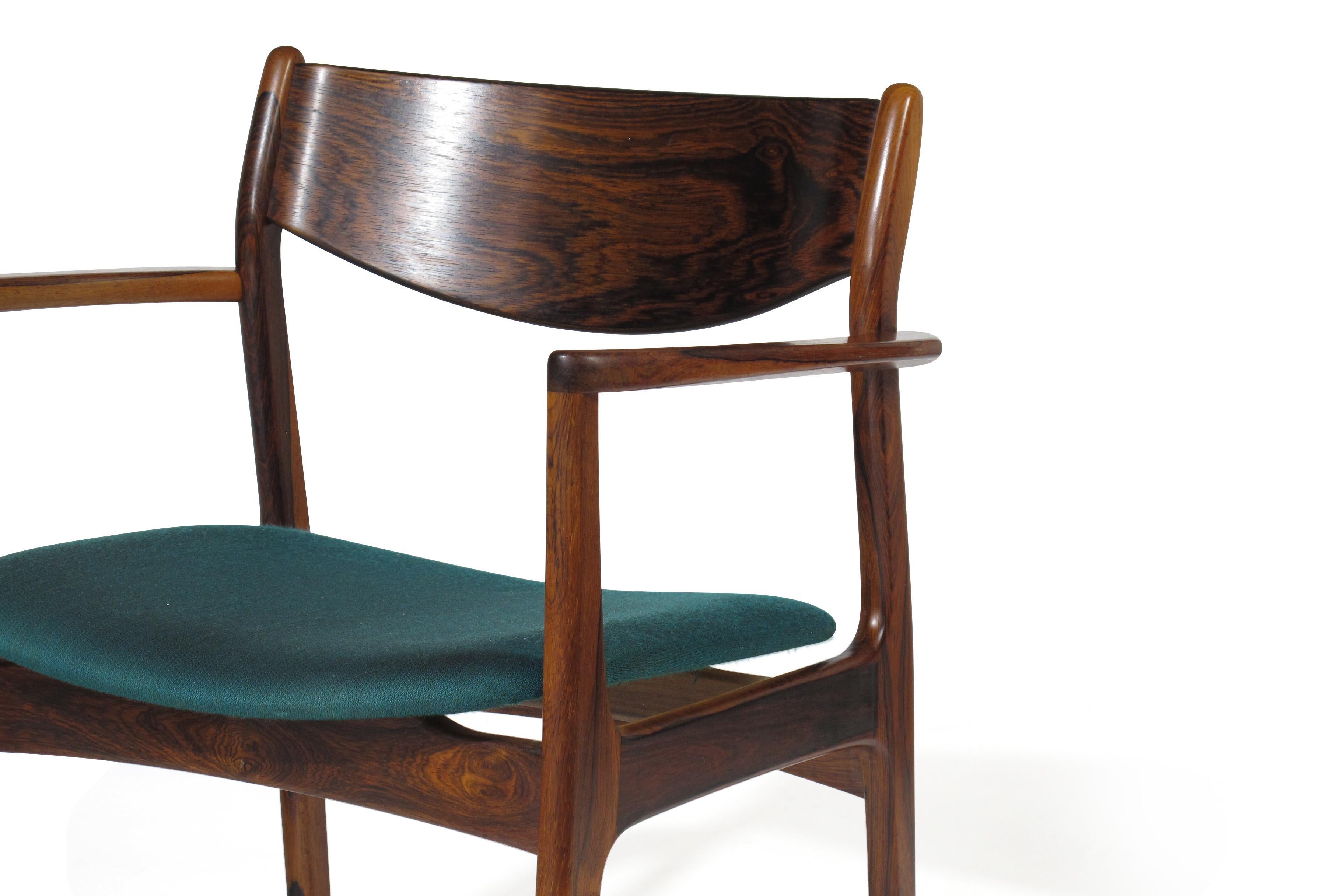 Pair of midcentury rosewood armchairs designed by P.E. Jorgensen for Farso Stolefarik. Chairs have a comfortable backrest and crafted of dark figured rosewood, upholstered in the original teal wool fabric which has been steam cleaned and restored.